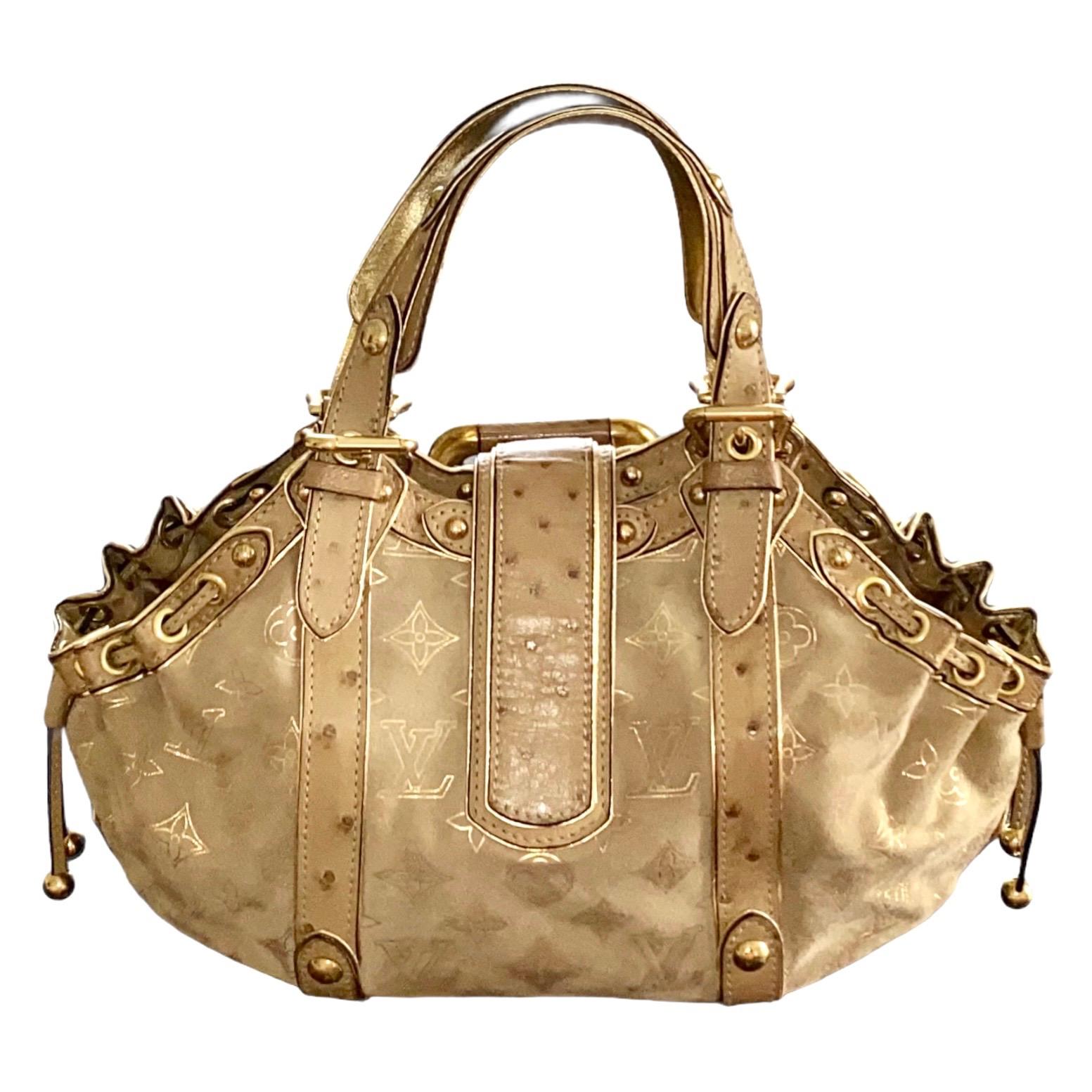 A stunning beige & gold suede and ostrich skin bag by Louis Vuitton
This bag was produced in a limited edition and made to order 
Finest suede leather imprinted with the famous LV monogram logo
Golden hardware
Ostrich skin trimming
Lined with