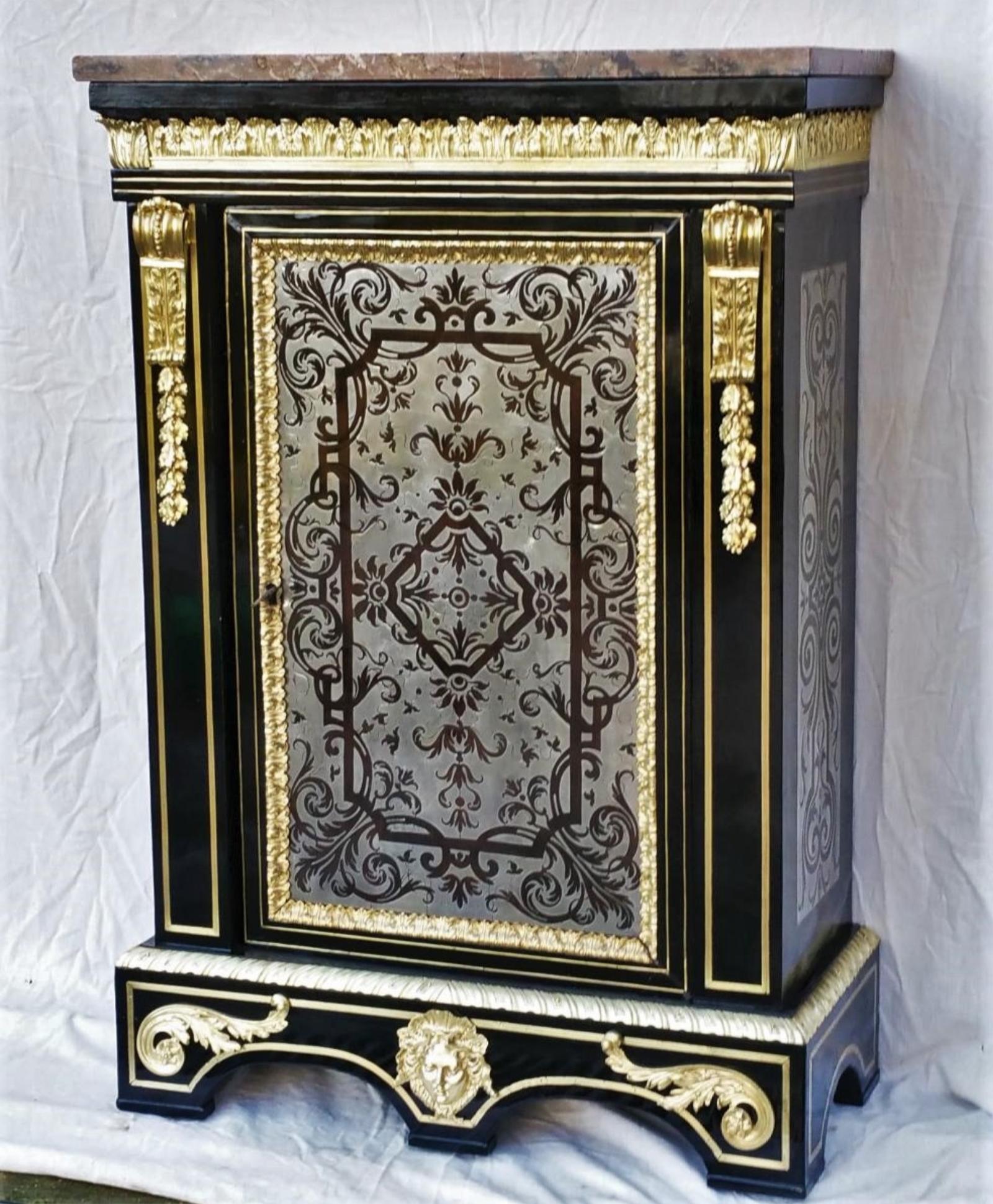 Stunning Louis XIV style cabinet, 18th century in ebony veneer with rich Boulle pewter inlays and precious woods throughout the facade and sides.
Thick and rich gilt bronze ornaments, acanthus cornice leaves, original beautiful color marble in good