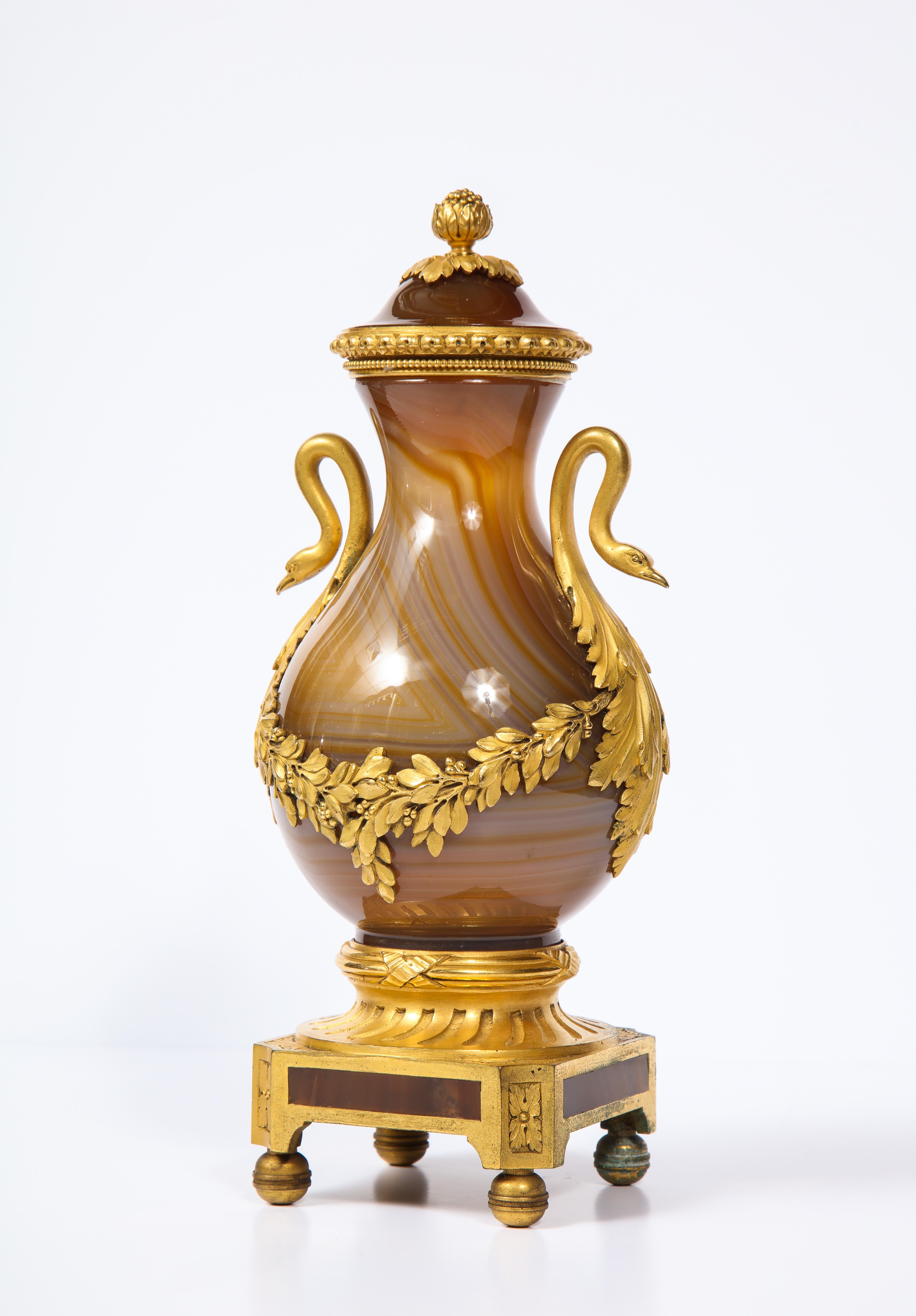 A magnificent Louis XVI Style Russian ormolu-mounted covered agate vase or Urn with finely hand-chiseled and Cast doré Bronze Swan Handles. This marvellous baluster form covered vase has been beautifully hollowed and hand carved from an exceptional