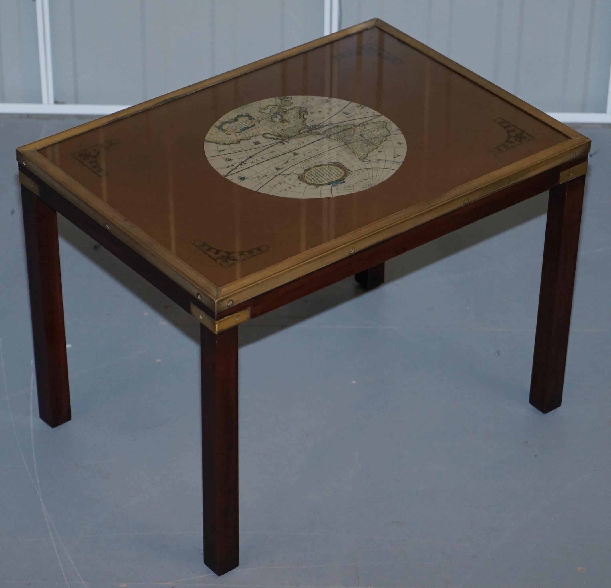 We are delighted to offer for sale this lovely nest of three side tables with world maps detailing

A nice decorative set, each one has a good quality print of a world map. They are made in the military campaign style so brass fittings and in