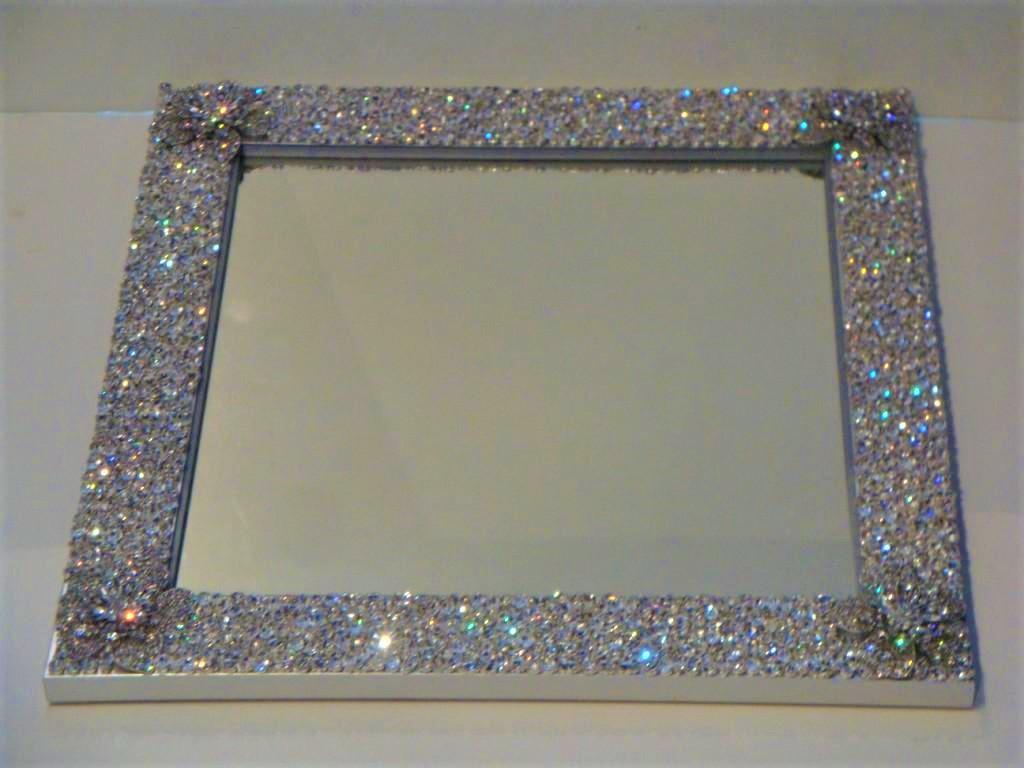 The Following Item we are Offering is A Spectacular Large Limited Edition Metallic Painted Mirror with SWAROVSKI Crystals, Brooches, and Stones. The Mirror is Beautifully adorned with many various clear Swarovski stones and crystals as well as