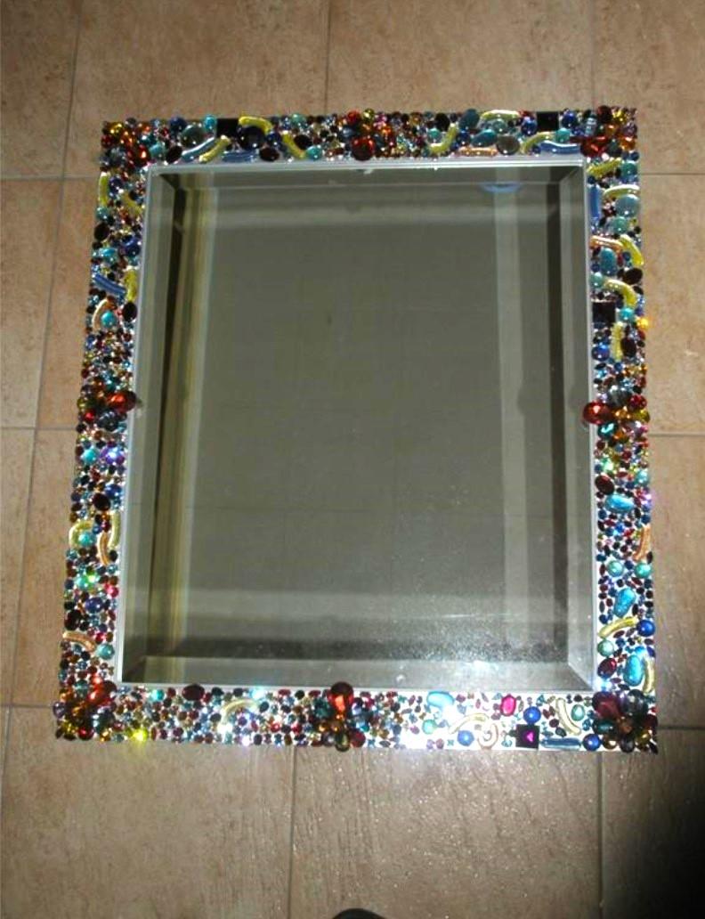 The Following Item we are Offering is A Spectacular Large Limited Edition Cartier Style Metallic Painted Mirror with SWAROVSKI Crystals, Brooches, and Stones from all over the World. The Mirror is Beautifully adorned with many various Fancy Colored