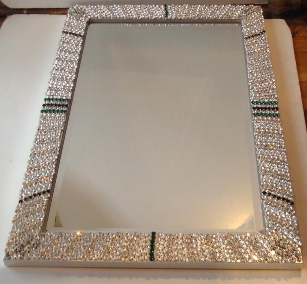 The Following Item we are Offering is A Spectacular Large Limited Edition Cartier Style Metallic Painted Mirror with SWAROVSKI Crystals, Brooches, and Stones from all over the World. The Mirror is Beautifully adorned with many various Crystal Clear