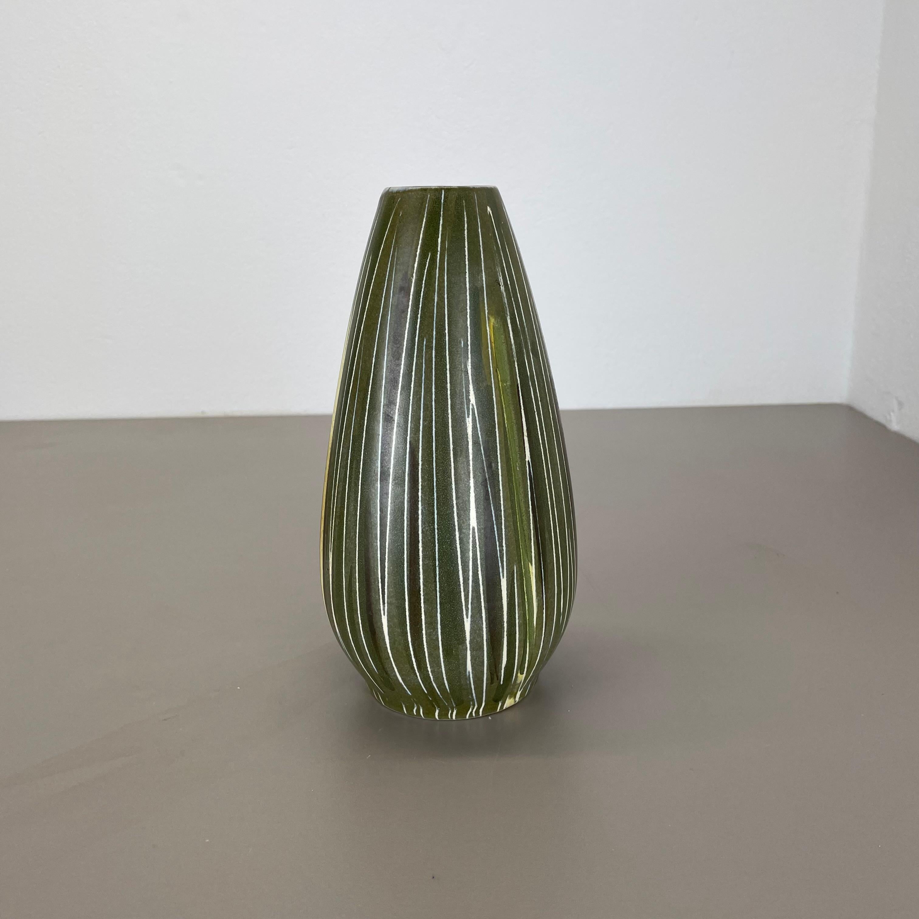 Article:

Ceramic vase


Producer:

Übelacker Ceramics, Germany


Decade:

1970s





This original vintage Pottery vase was  produced in the 1970s by Übelacker Ceramics, Germany. Rare form with a nice abstract illustration in green tones with lines