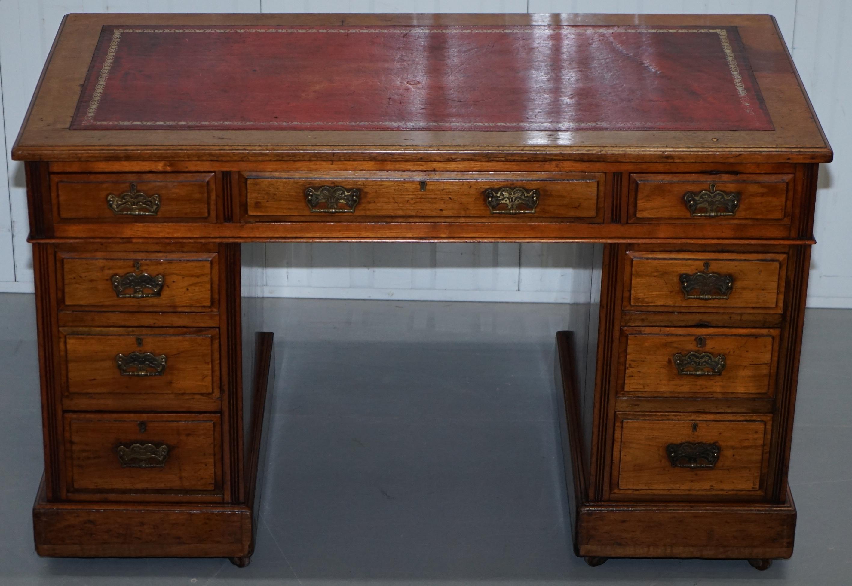 We are delighted to offer for sale this lovely original solid Walnut Victorian twin pedestal partner desk with gold leaf embossed oxblood leather writing surface and original Victorian Porcelain castors

A very good looking and high-end quality