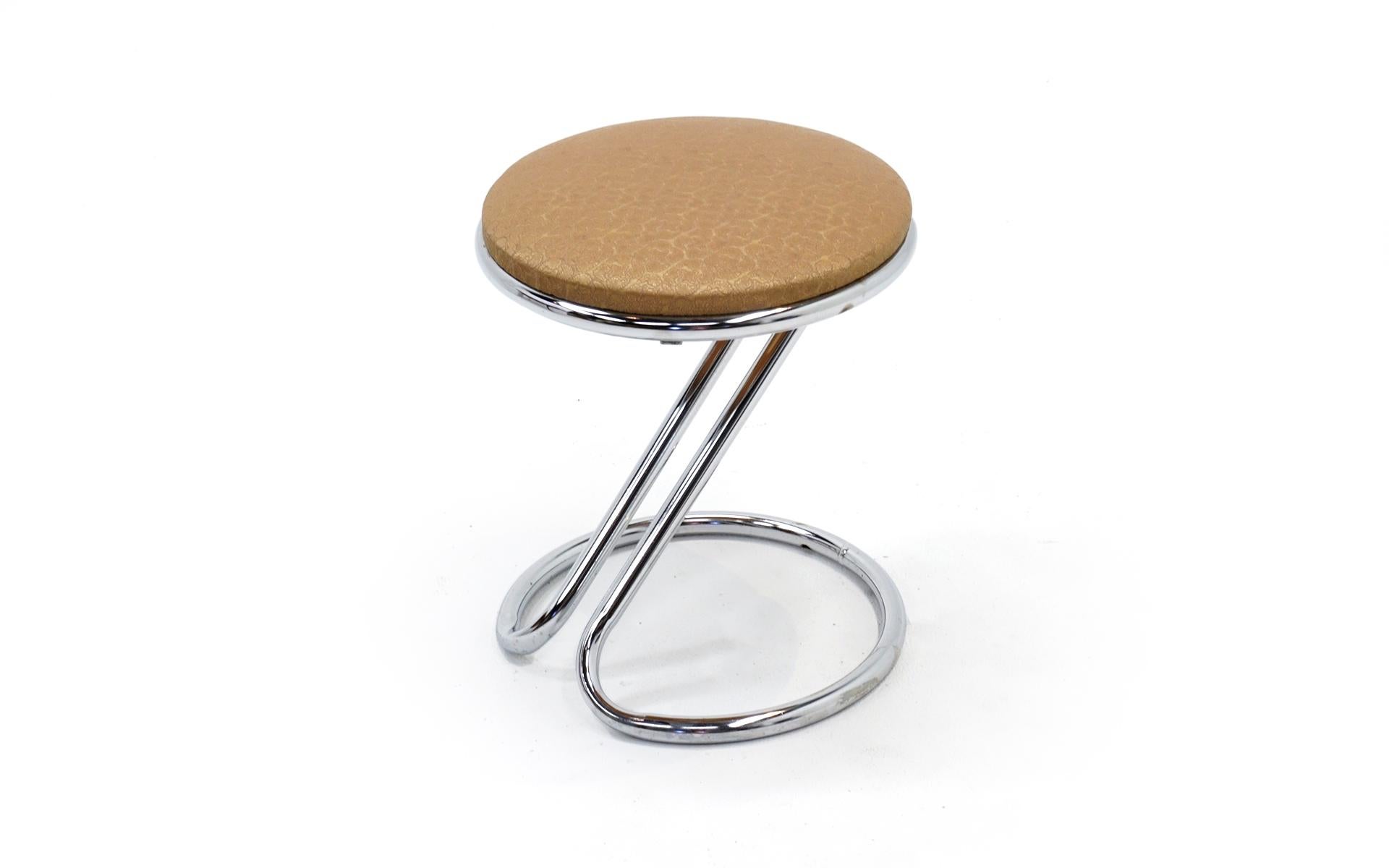 Rare short work stool or vanity stool designed by Gilbert Rohde and made by Troy Sunshade Company. The chrome and upholstery are both in very good to excellent condition. Retains the original Troy Sunshade label on the underside of the seat.