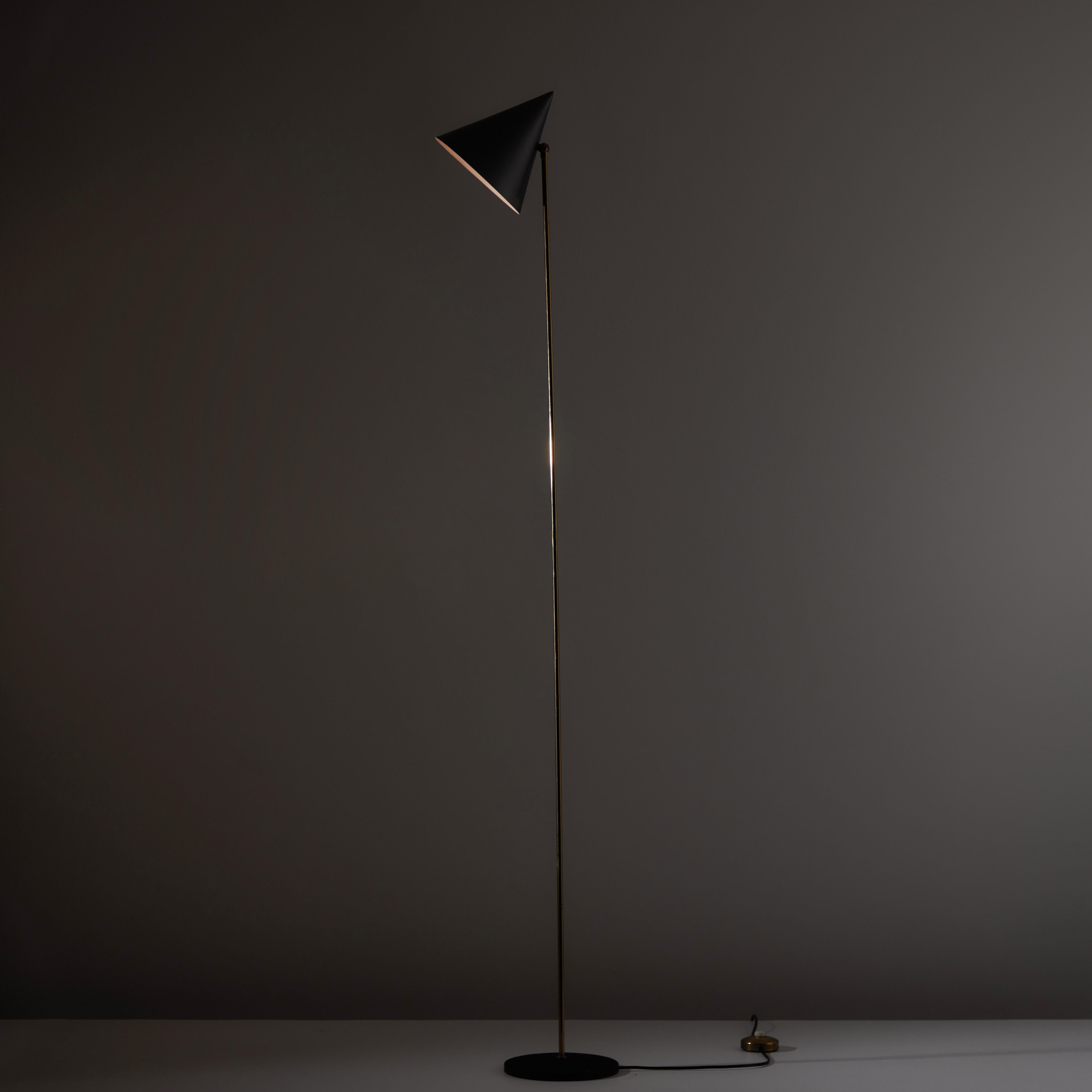 LTE 5 floor lamp by Luigi Caccia Dominioni for Azucena. Designed and manufactured in Italy, 1953. Slender enameled brass floor lamp with sharp conical shade and cast iron base. We recommend using one 60w max E27 bulb. Wired for US standards. Bulb