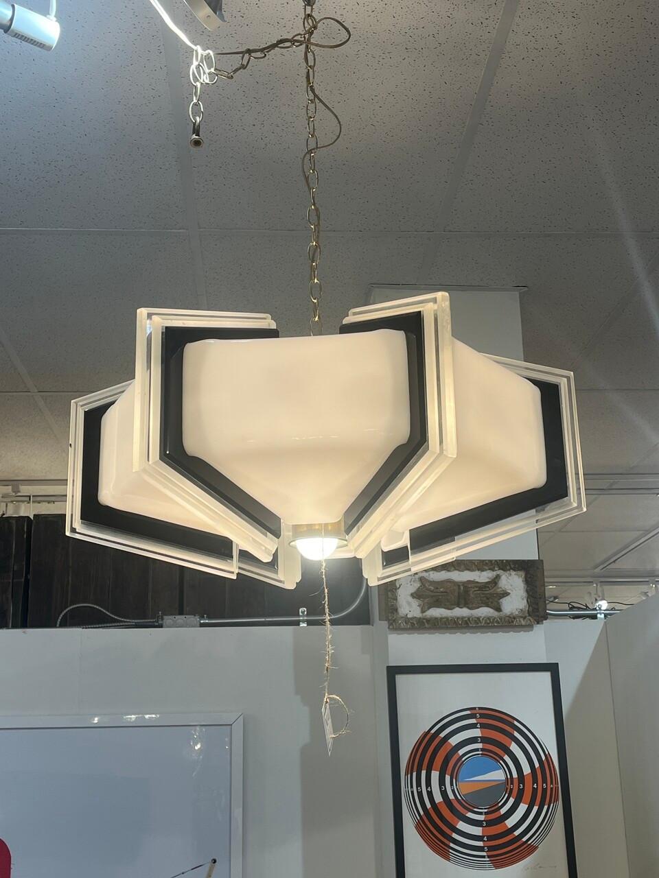 Rare Lucite Mid-Century Space-Age Chandelier, a one-of-a-kind design with clear, black and milk acrylic construction. It would easily cross over into an art deco room. Was not able to find another like it!