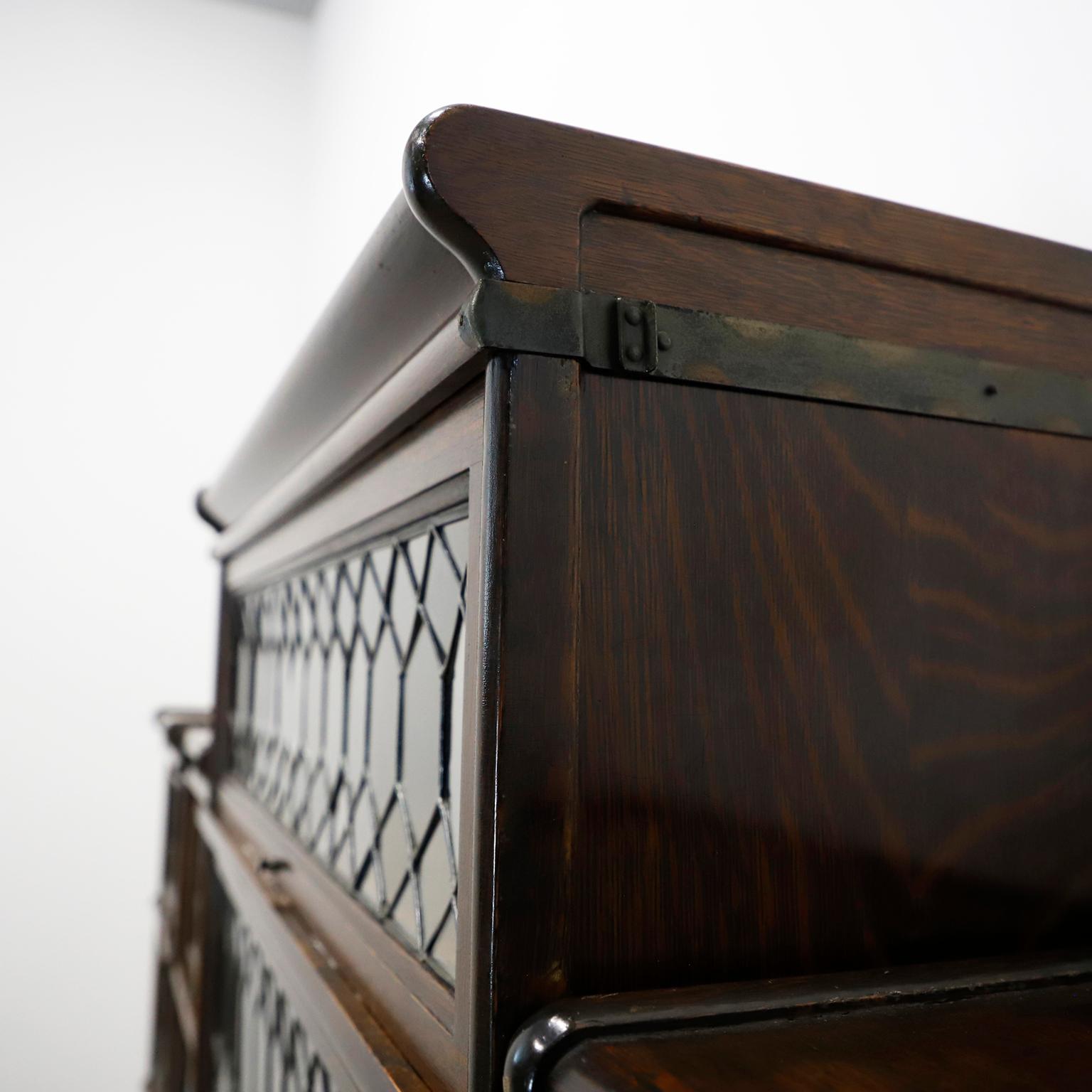 Industrial Rare Macey Sectional Bookcase made in Tiger Oak w/ Leaded Glass Doors. For Sale