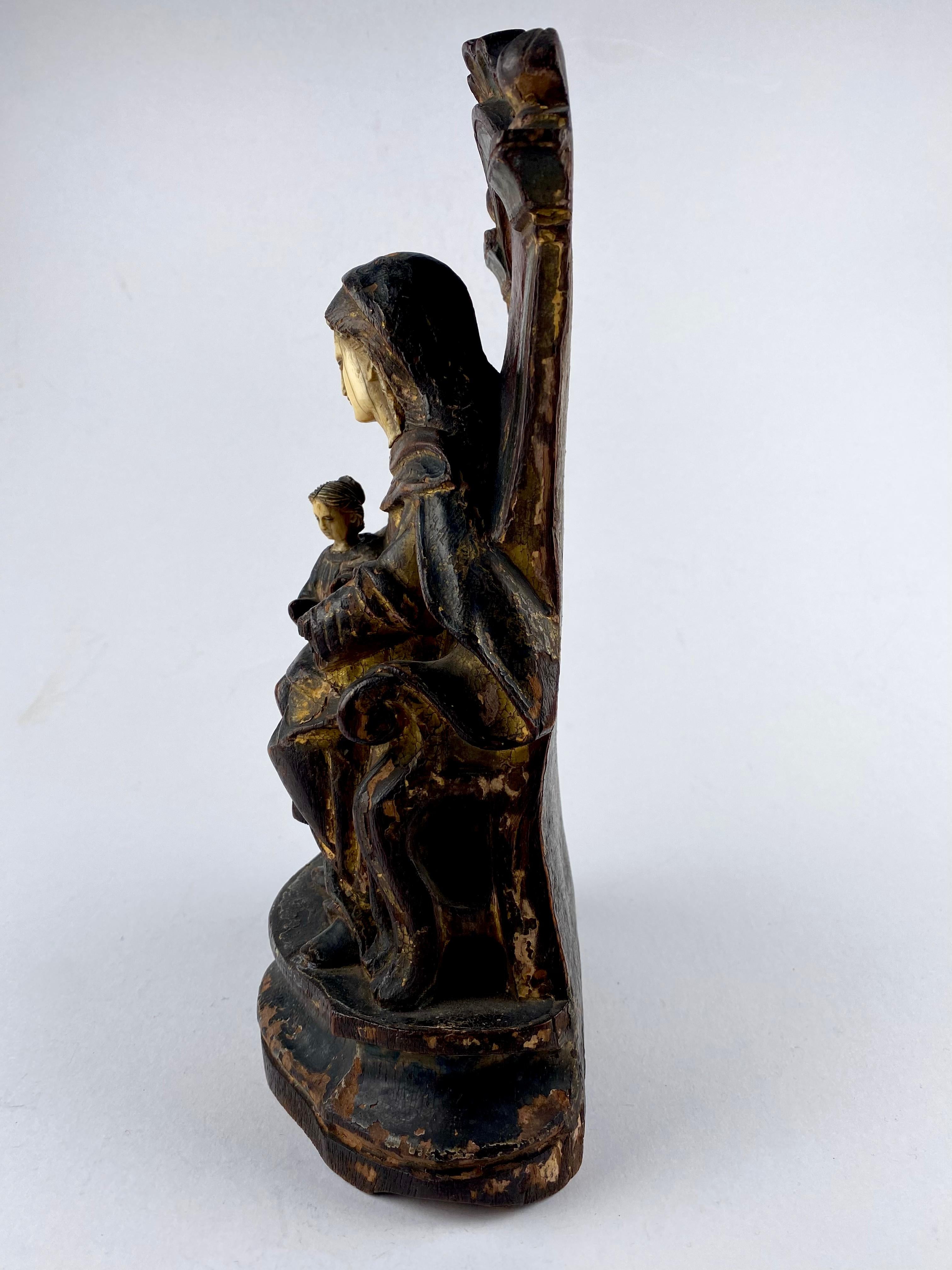 A very rare 18th century Indo Portuguese Religious Statue of Our Lady, Saint Anne the grandmother of Jesus.
Sculpted in India for the Portuguese market in wood with polychrome detailing 
Saint Anne is missing one hand and Mary is missing both of
