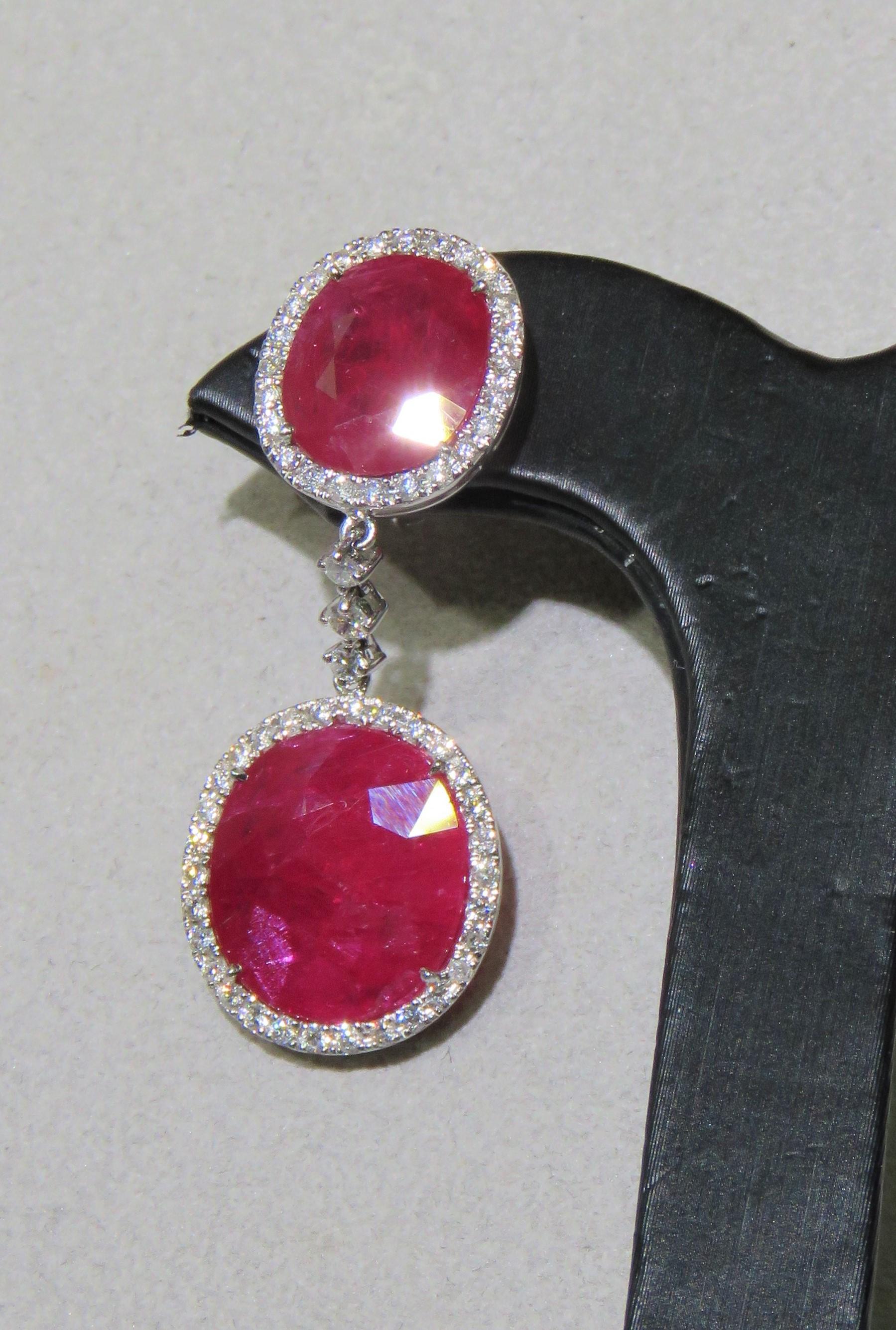 The Following Items we are offering is a Rare Important Radiant Pair of 18KT White Gold Winston Style Glistening Ruby Chandelier Drop Diamond Earrings! Magnificent Masterpieces!!! Approx T.C.W for Earrings Approx 40CTS!!!!
These Gorgeous Earrings