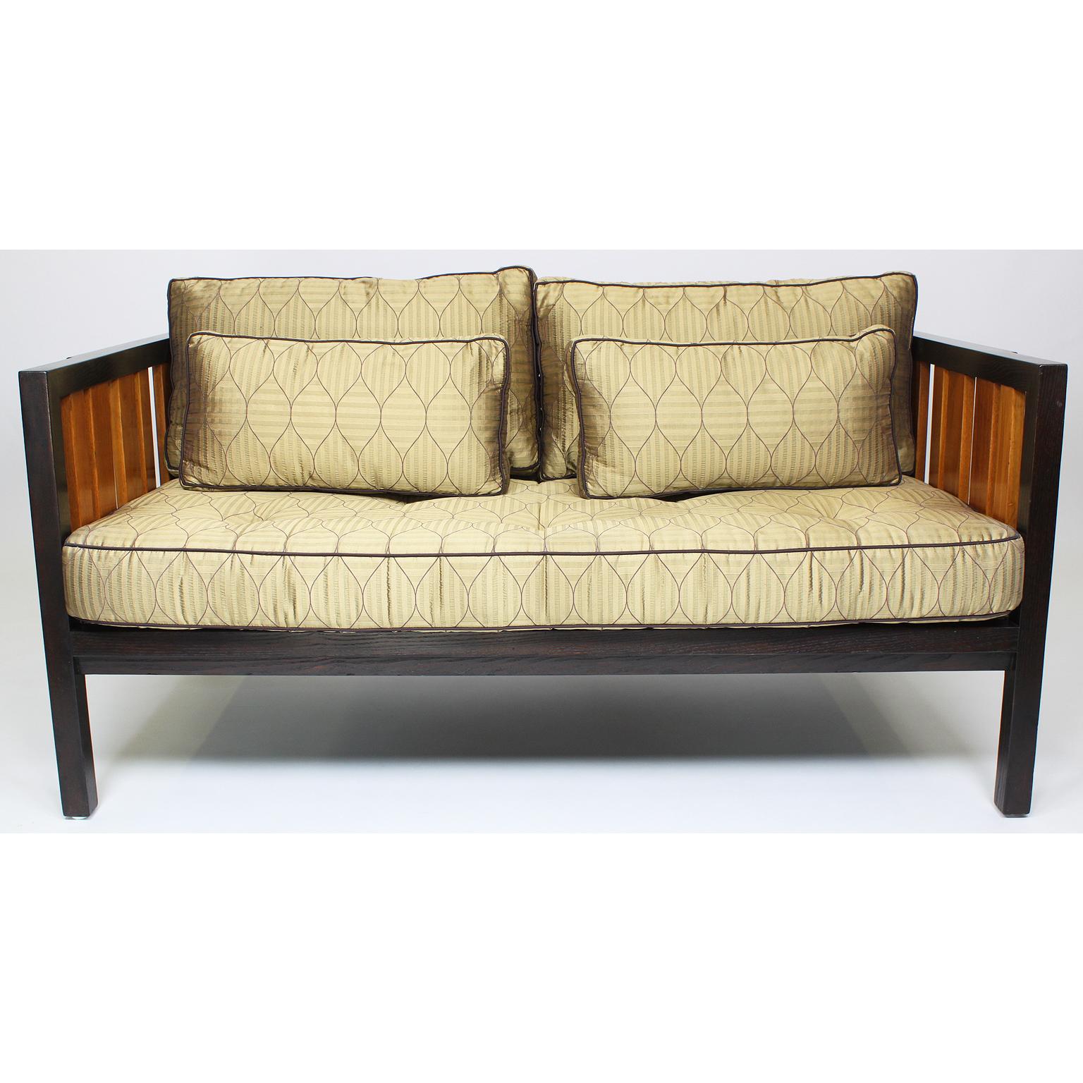 A fine and rare mahogany and ash loveseat, settee designed by Edward Wormley for Dunbar. The rectangular frame with grill ash wood panels and an 