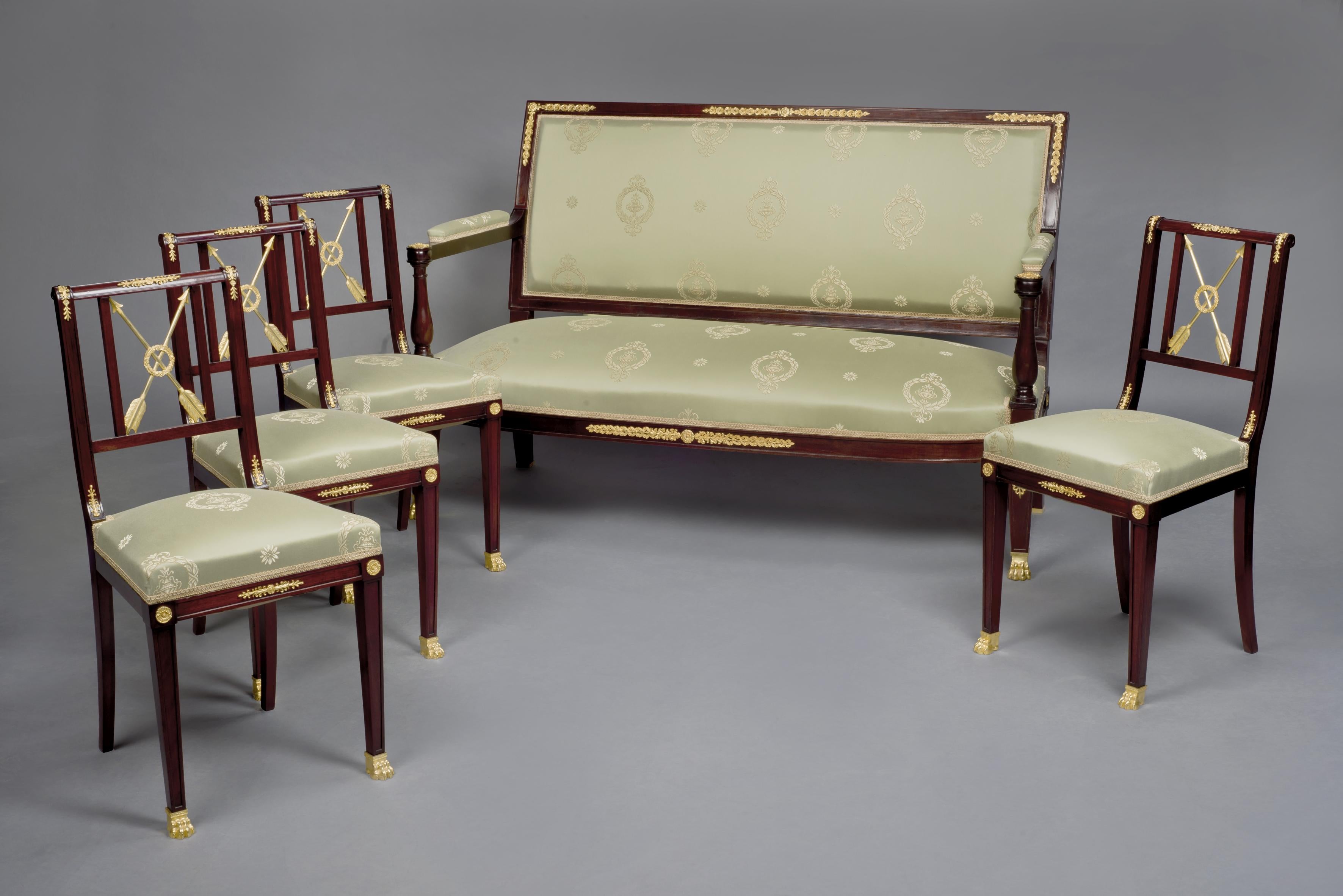 A rare gilt-bronze mounted mahogany Empire Revival salon suite by François Linke. 

French, circa 1910.

Stamped to the reverse of the bronze mounts ‘FL’. 

The original tacking underneath the chairs stencilled 'LINKE PARIS'.

The salon