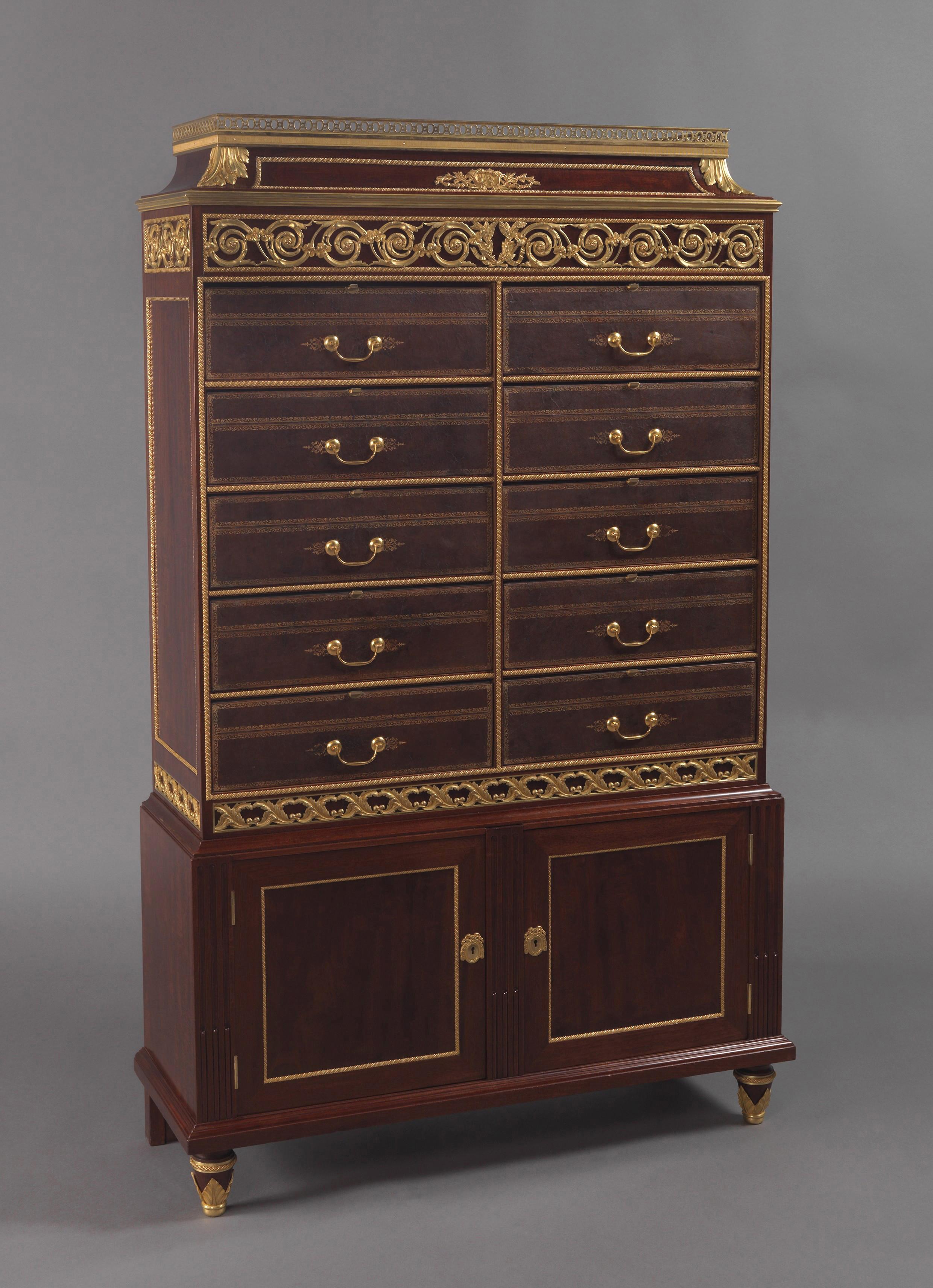 A rare gilt-bronze mounted mahogany Folio document cabinet by François Linke, with a unique locking system by Clément Linke.

French, circa 1900. 

Linke Index No: 2561.
Signed 'F. Linke' to front right side of the gallery. 
Stamped to the