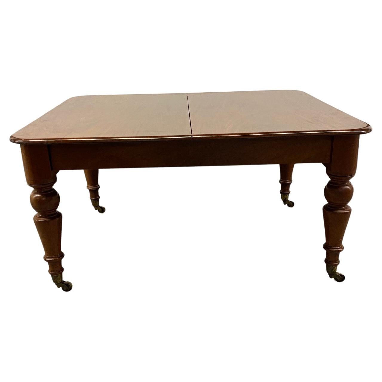 Rare Mahogany Samuel Hawkins crank dining table including 3 leaves. 118 inches when fully extended and 23 inches height under the skirt. Bearing brass medallion 
