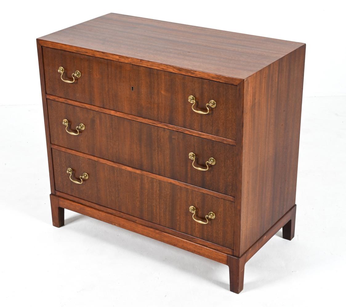 Enrich your living space with this exceptional Danish Mid-Century chest of drawers, designed by the esteemed Ole Wanscher and crafted by A. J. Iversen in the 1940's. This rare find exemplifies the epitome of Danish design, showcasing a harmonious