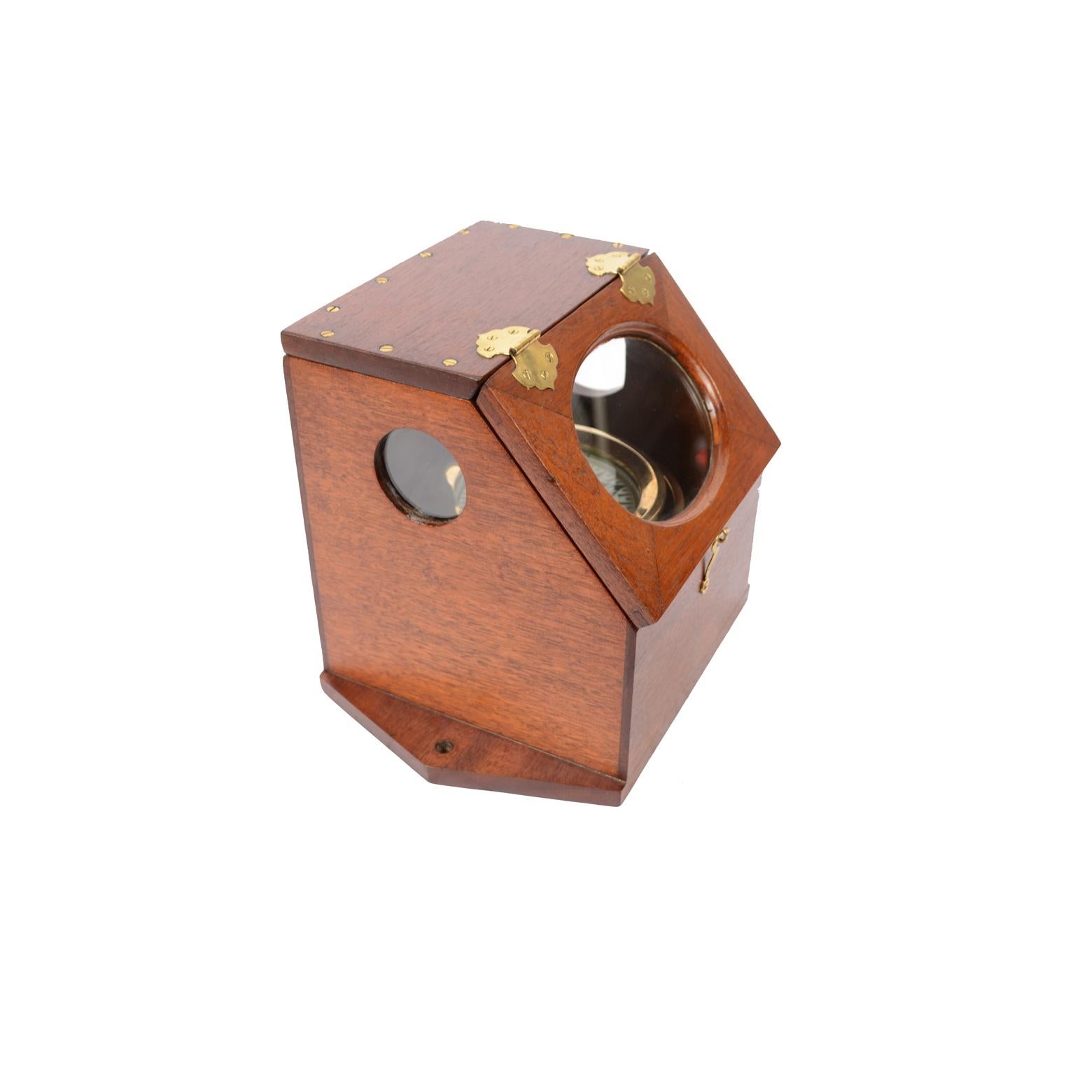 Rare mahogany wood binnacle compass. Inside there is a liquid compass mounted on a universal joint signed D. Baker Melrose Mass Pat. 22 Sept 1896 and marketed by the Chas Company. C. Hutchinson Agent 152 State St Boston. Good condition, the light is