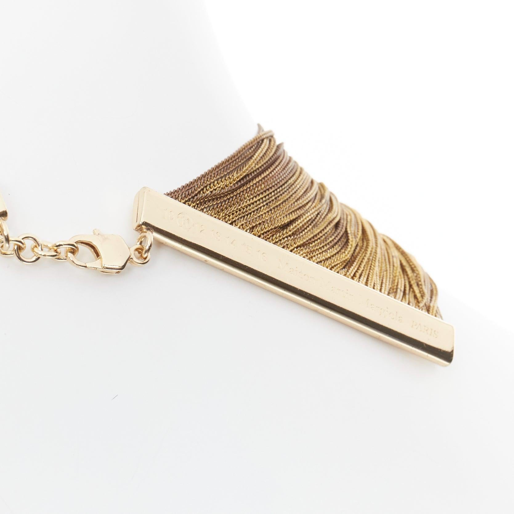 rare MAISON MARGIELA Line 11 Vintage gold tone multi chain cleopatra necklace
Reference: TGAS/E00729
Brand: Maison Margiela
Collection: Line 11
Material: Metal
Color: Gold, Silver
Pattern: Solid
Closure: Lobster Clasp

CONDITION:
Condition: Good,