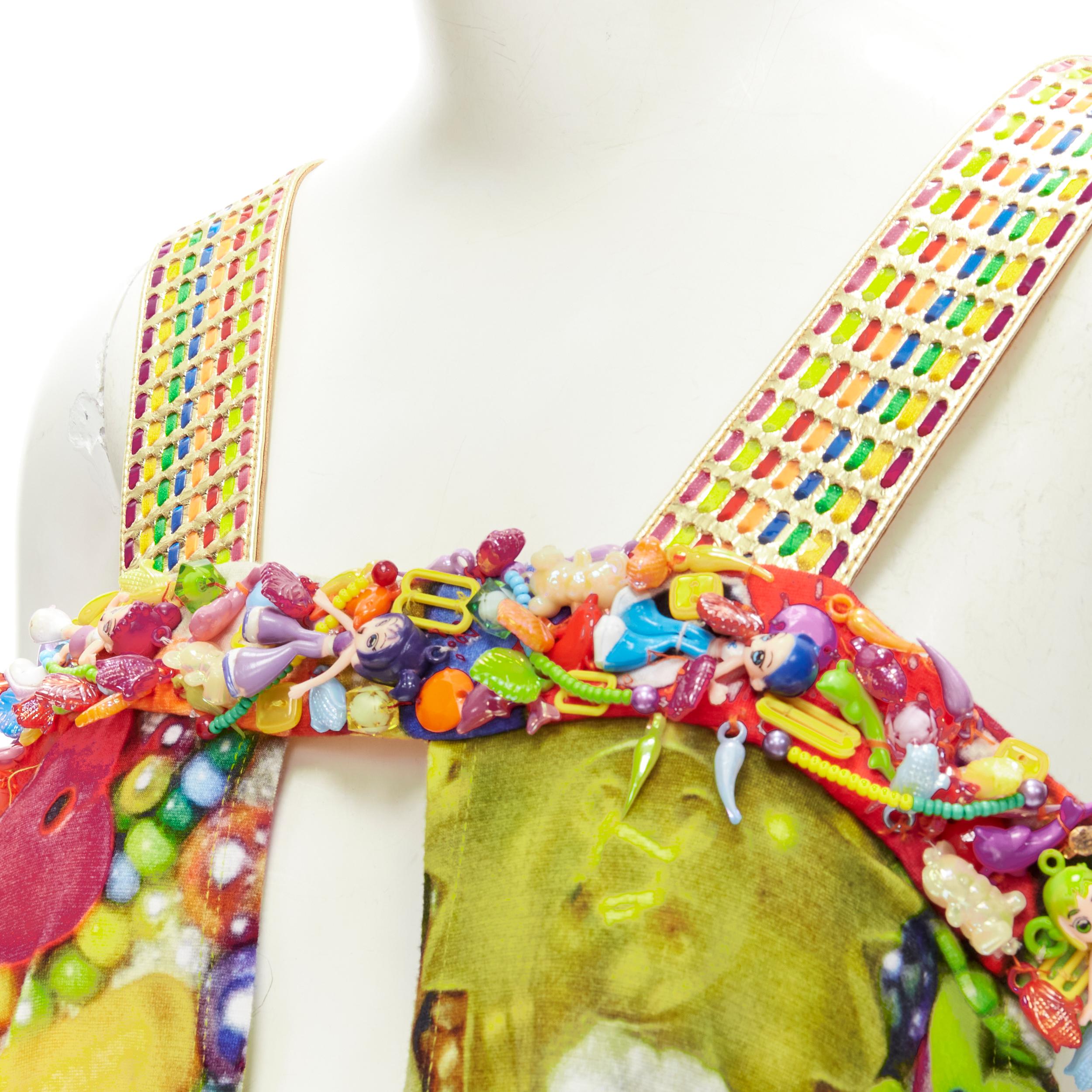 rare MANISH ARORA Doll Toys embellished slit front printed top 
Reference: ANWU/A00600 
Brand: Manish Arora 
Material: Cotton 
Color: Multi 
Pattern: Abstract 
Extra Detail: Rainbow thread metallic gold weaved shoulder strap. Toy Dolls