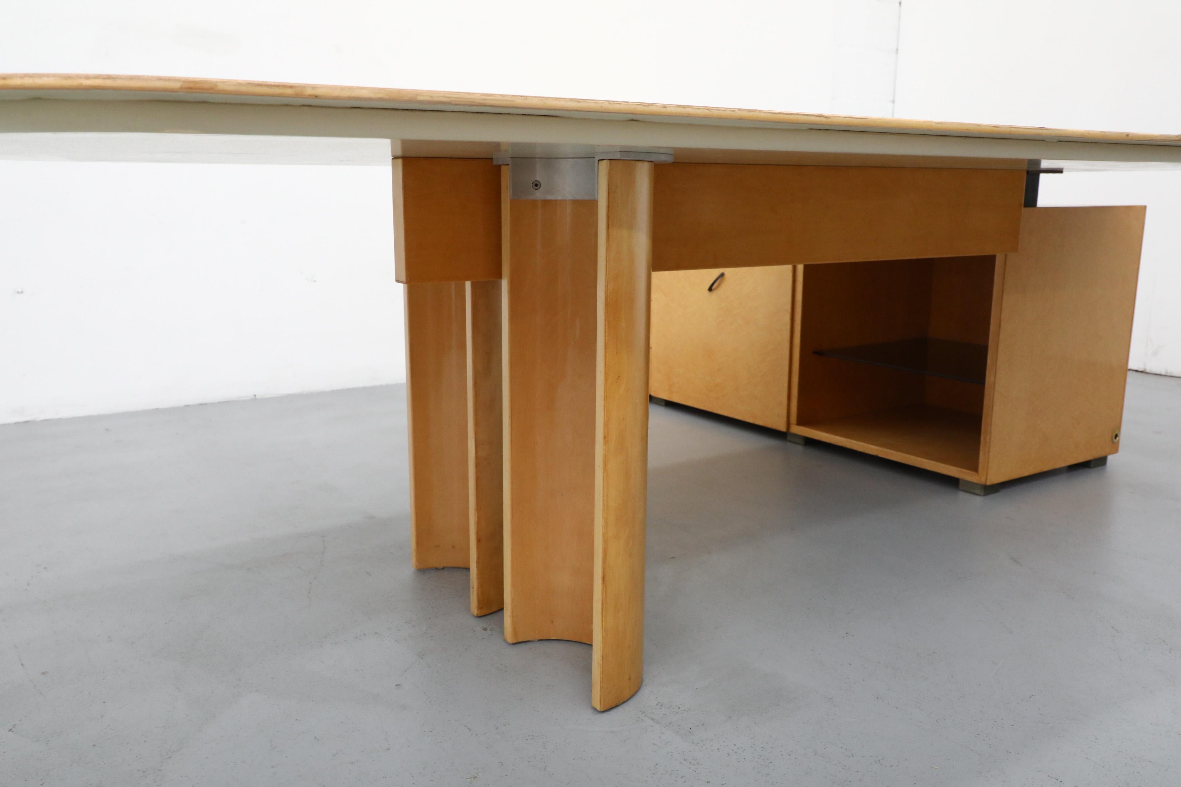 Simply gorgeous maple desk with return and generous storage by Italian design great Giovanni Offredi for the internationally acclaimed Saporiti company. Meticulously designed and instantly recognizable by the characteristically offset drawer