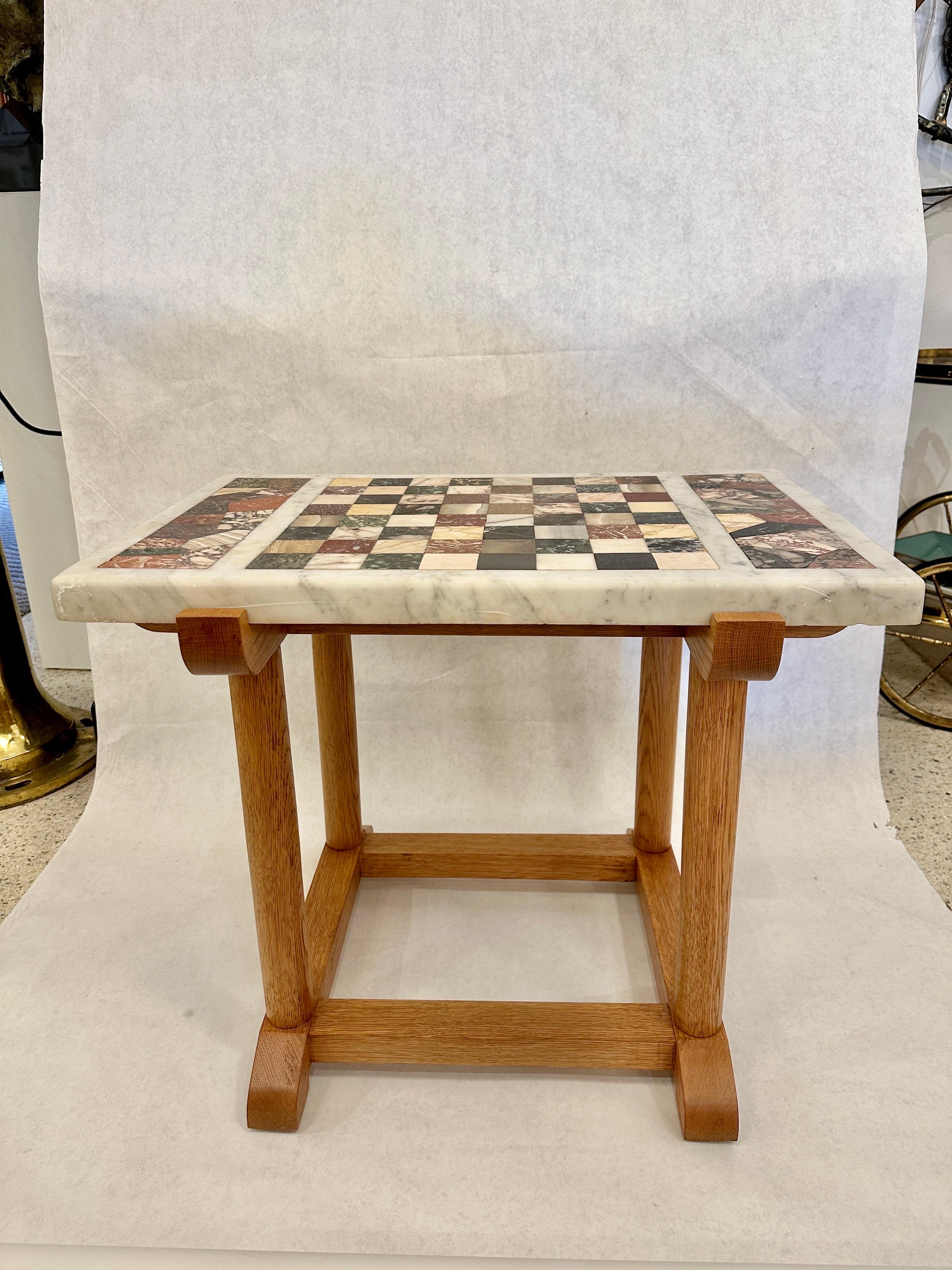 In the manner of Swedish furniture designer, Axel Einar Hjorth, this beautiful oak base side table with an antique marble chess top, features many rare stones including porphyry marble. Details abound on this wonderfully unique side table. SEE ALL
