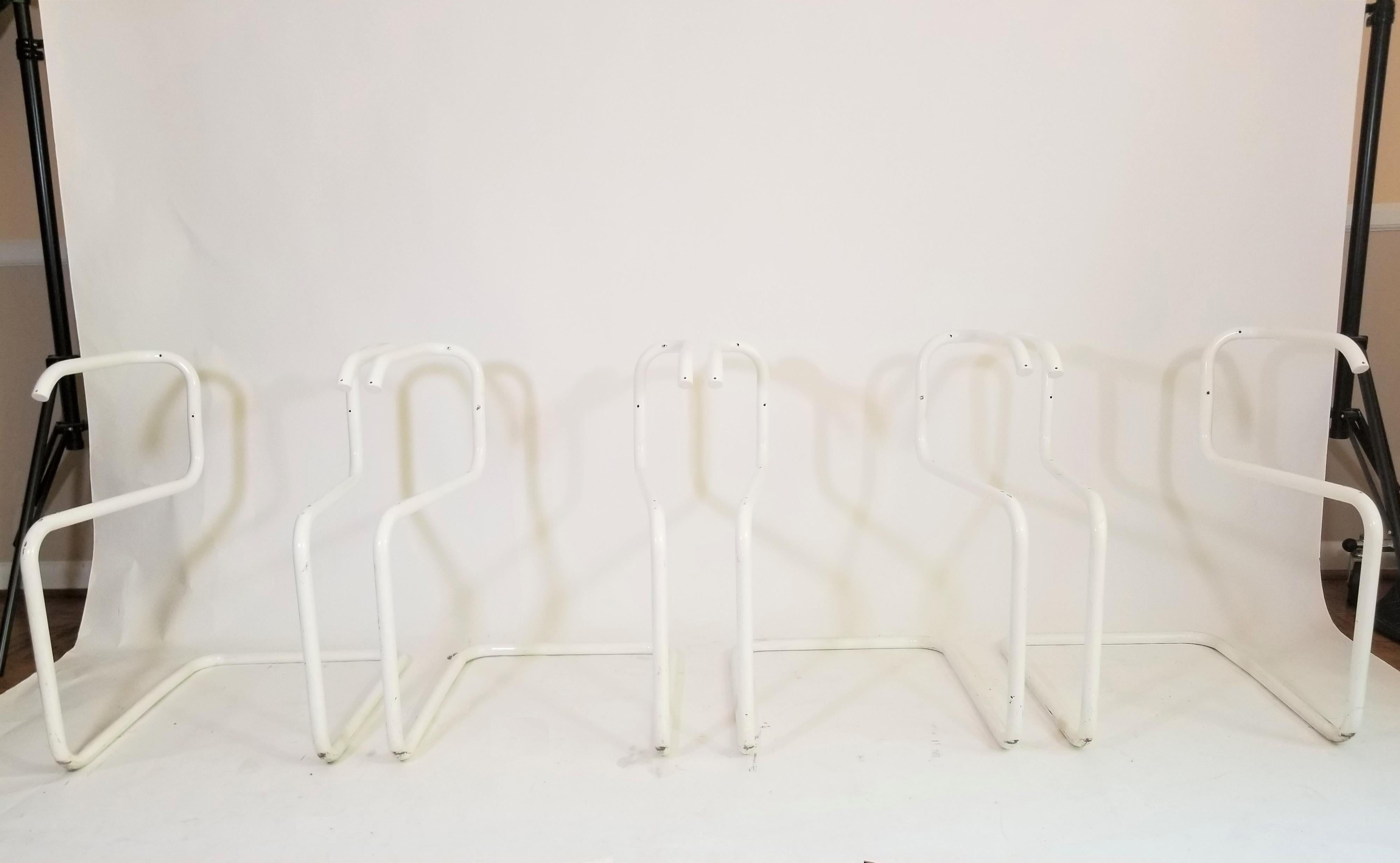Purchased directly from a retired Designer for Knoll. Rare white powder coating on these Classic Marcel Breuer Cesca Chairs. White powder coating was used on a very limited amount of chairs in the early 1980s. Set of 4. Classic cane seats and backs
