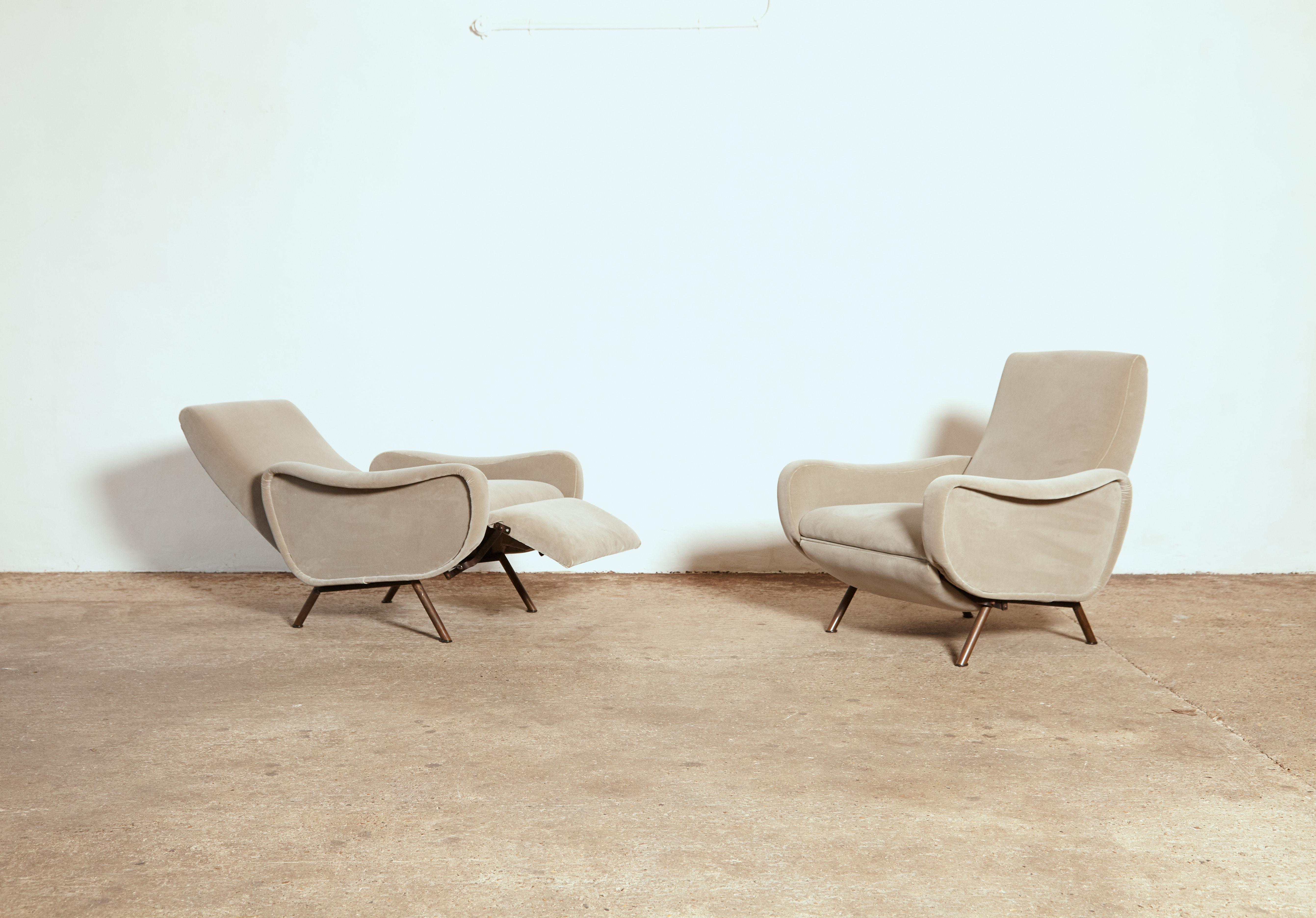 A rare pair of Pizetti Roma Marco Zanuso reclining lady chairs, Italy, 1960s. Newly reupholstered in silver grey velvet with patinated brass legs.

Measures: H 84cm 
W 81cm 
D 96cm
Seat height 43cm
Length when reclined 136cm.
 