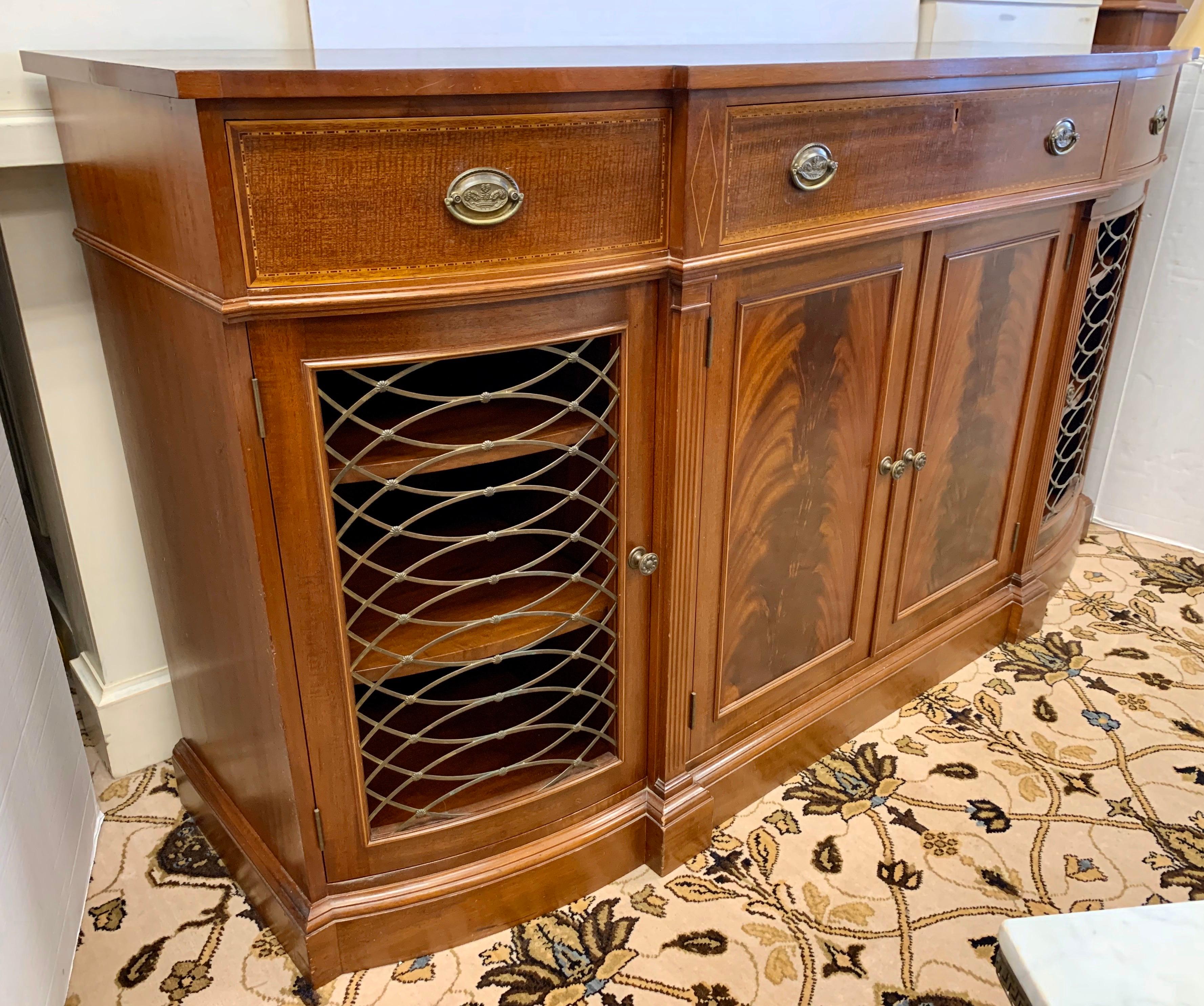 Rare Margolis exceptionally handcrafted mahogany sideboard with center flame mahogany doors flanked by brass grillwork doors. Has three more drawers for flatware, etc. Signed Margolis on back.