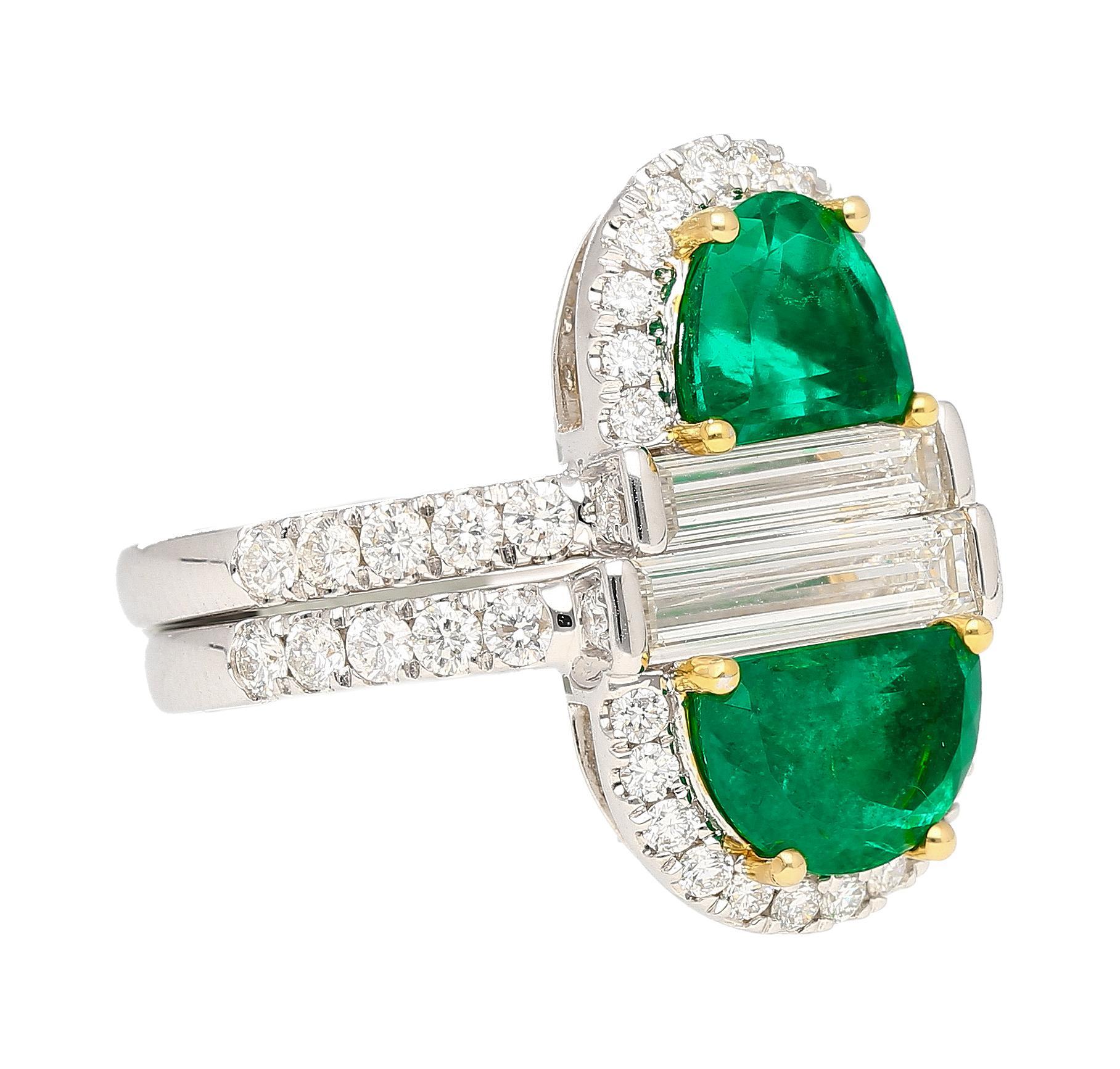 Presenting a Colombian emerald stack ring like none you will ever see again. A stunning marriage of nature's miraculous gifts and human artistry. Set with two half moon cut natural emeralds that stack on top of each other. This ring forms a