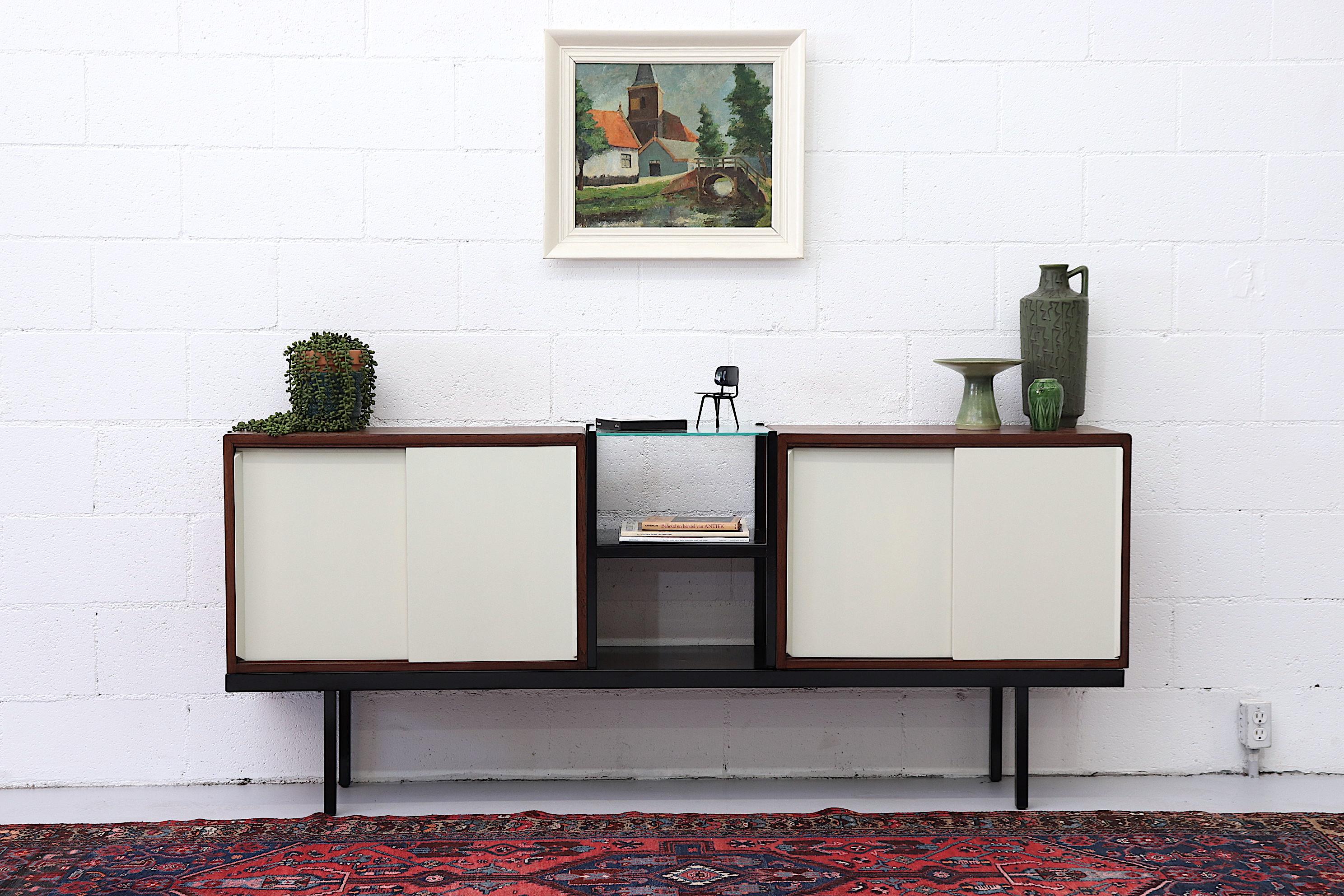 Rare teak Bornholm KW63 modular storage system with 2 cabinets and a small square 2-tiered metal and glass by Martin Visser for Spectrum, 1950s. Storage cabinets are teak with white painted wood doors and interior shelving. Lightly refinished