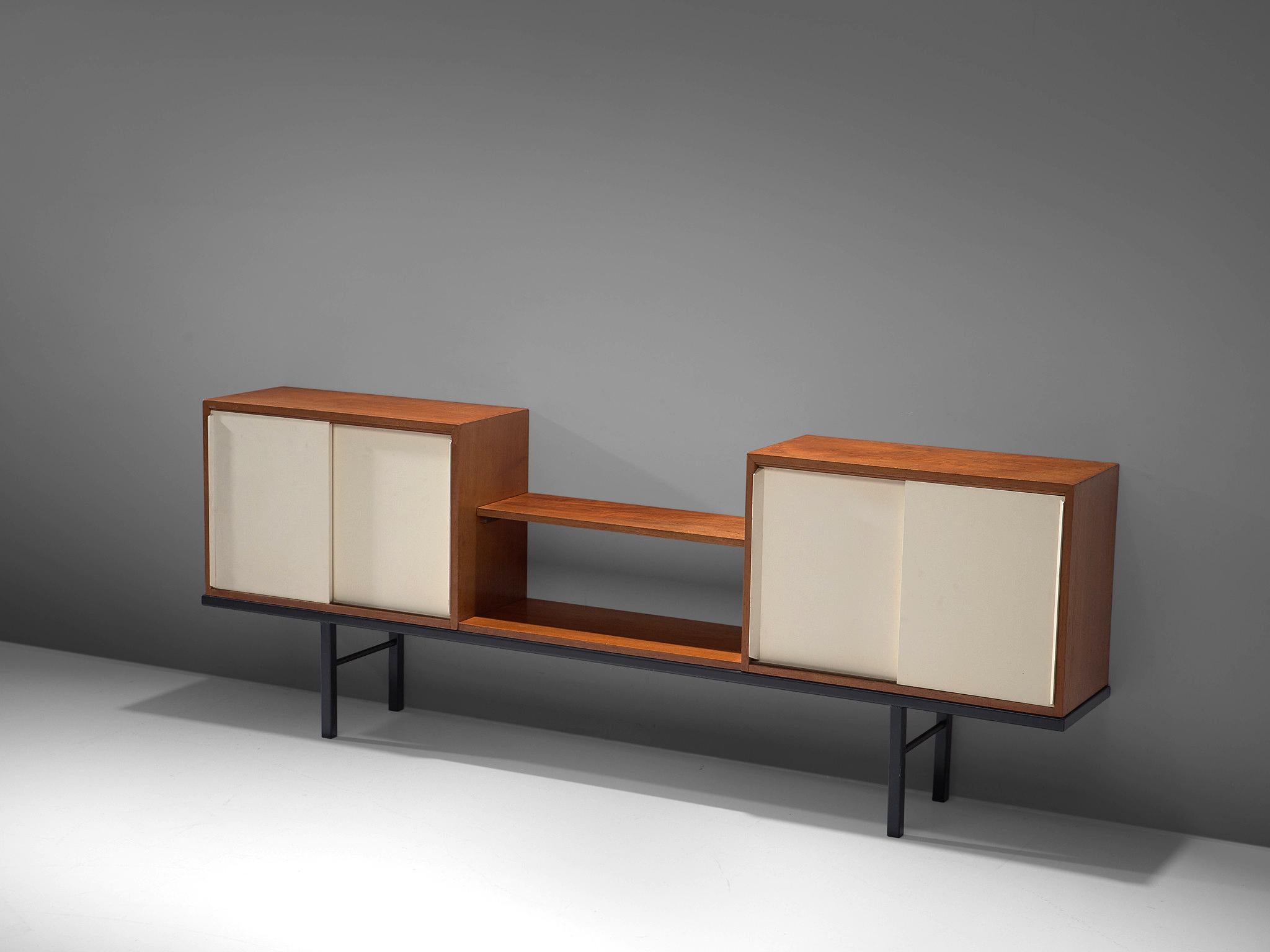 Martin Visser for 't Spectrum, pair of sideboards, Bornholm collection KW63, wood, metal, and glass, the Netherlands, 1956-1959.

This rare sideboard is executed in mixed materials. The credenza features a Minimalist black metal base and two