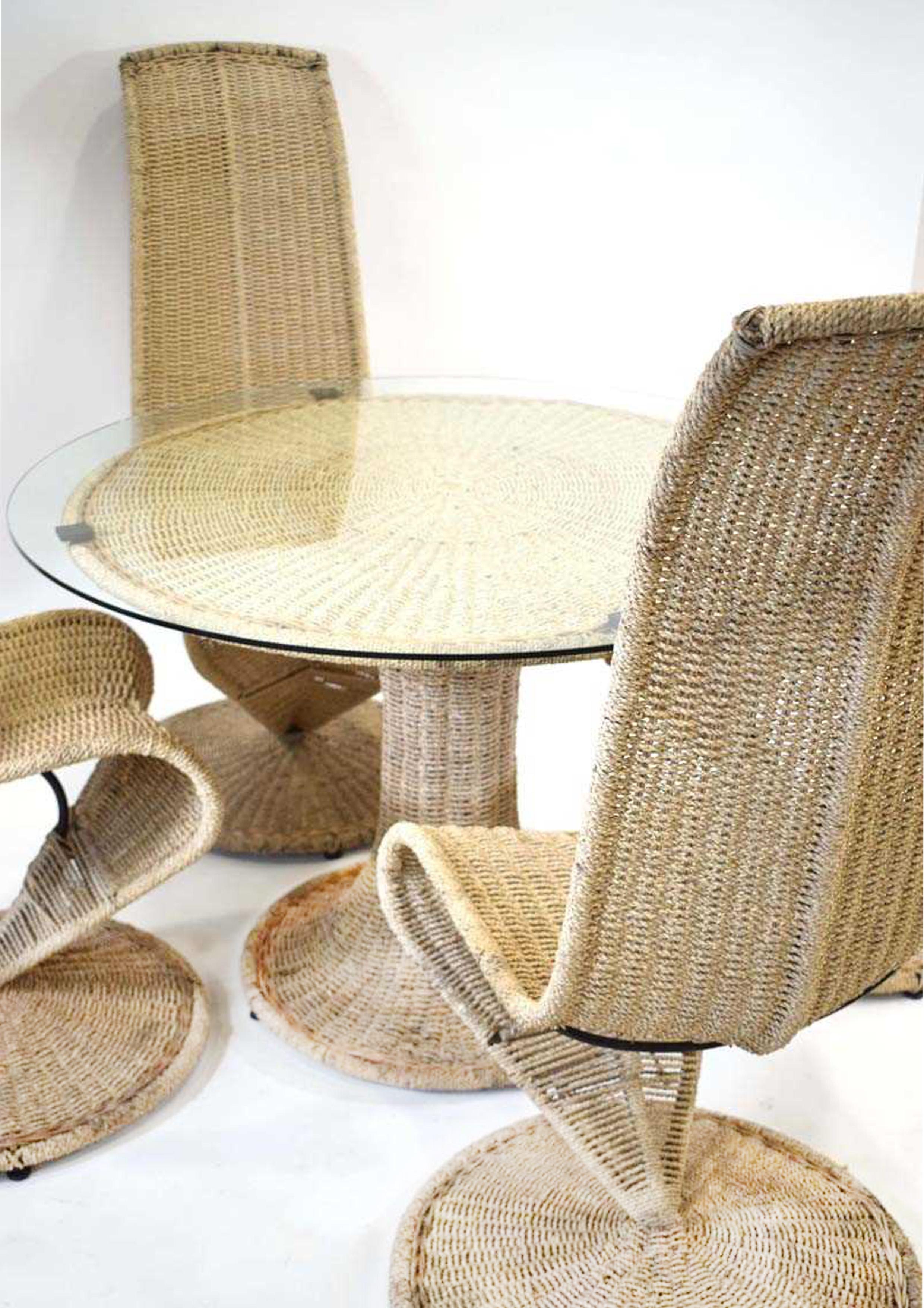 A Rare Marzio Cecchi Circular Glass, Metal & Wicker Pedestal Dining Table With A Set Of Four Woven S Chairs 1970's Made In Italy 1972 

Table diameter 111 cm

CHAIRS
Height 120cm
Width 62cm
Depth 60cm

The table is seldom seen, i've personally not