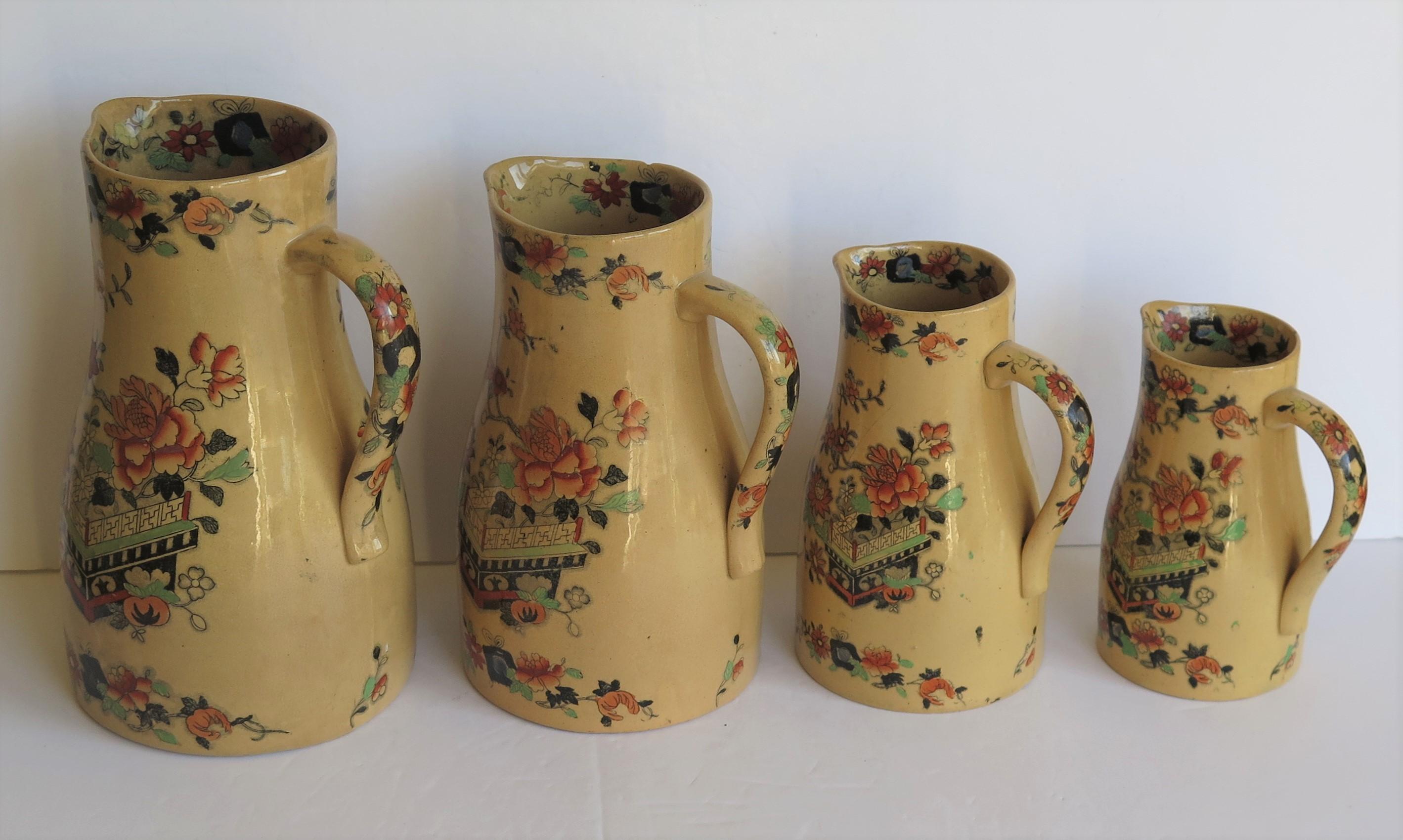This is a very rare set of four graduated jugs or pitchers by Mason's Ironstone pottery in the flower box pattern all dating to the mid-19th century, circa 1830-1851 Victorian period.

The jugs are all potted in one of Mason's Classic Jug shapes