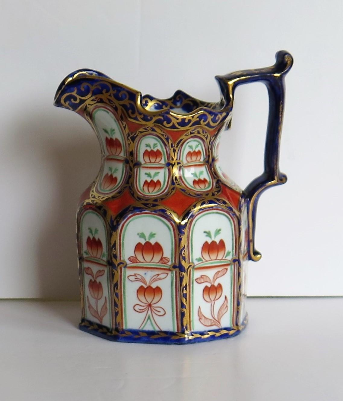 This is a rare jug or pitcher with Gothic style arched panels and hand painted gilded pattern made by Mason's ironstone pottery, circa 1835.

This jug has a rare shape, a very rare pattern and a rarely seen red Mason's printed mark to the