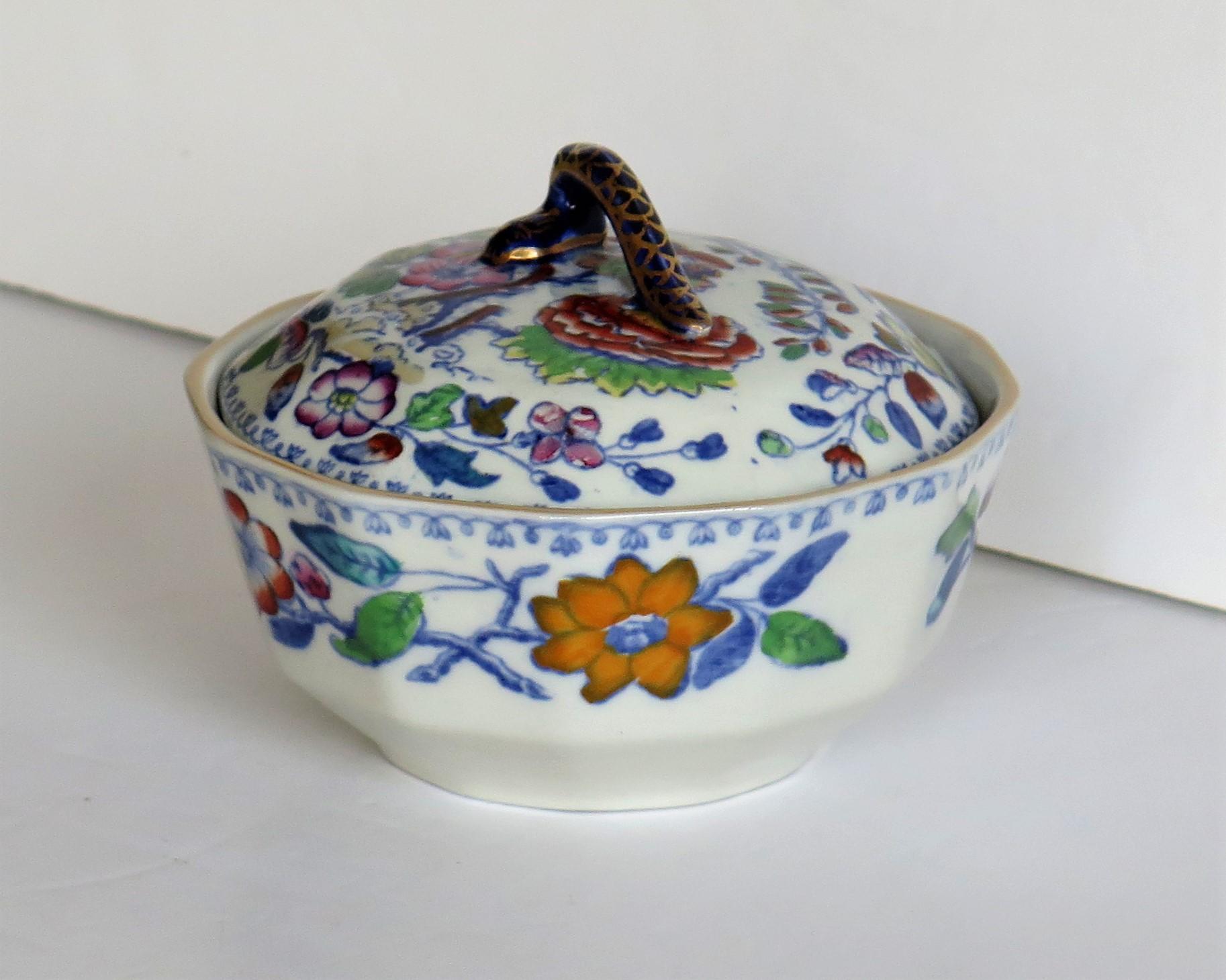This is a rare ironstone lidded dish or bowl in a rare shape, hand enameled in the Flying Bird pattern, made by Mason's Ironstone of Lane Delph, Staffordshire, England, during the late 19th century, circa 1890.

This Dish is well potted with 12