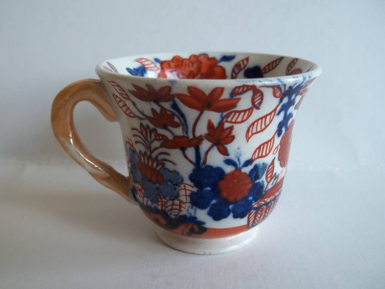This is a miniature Mason's ironstone cup in the Japan basket pattern which we date to circa 1825.

Miniature or toy items of Masons ironstone are rare and hard to find today.

This is a very attractive cup with a flared rim on a pedestal base