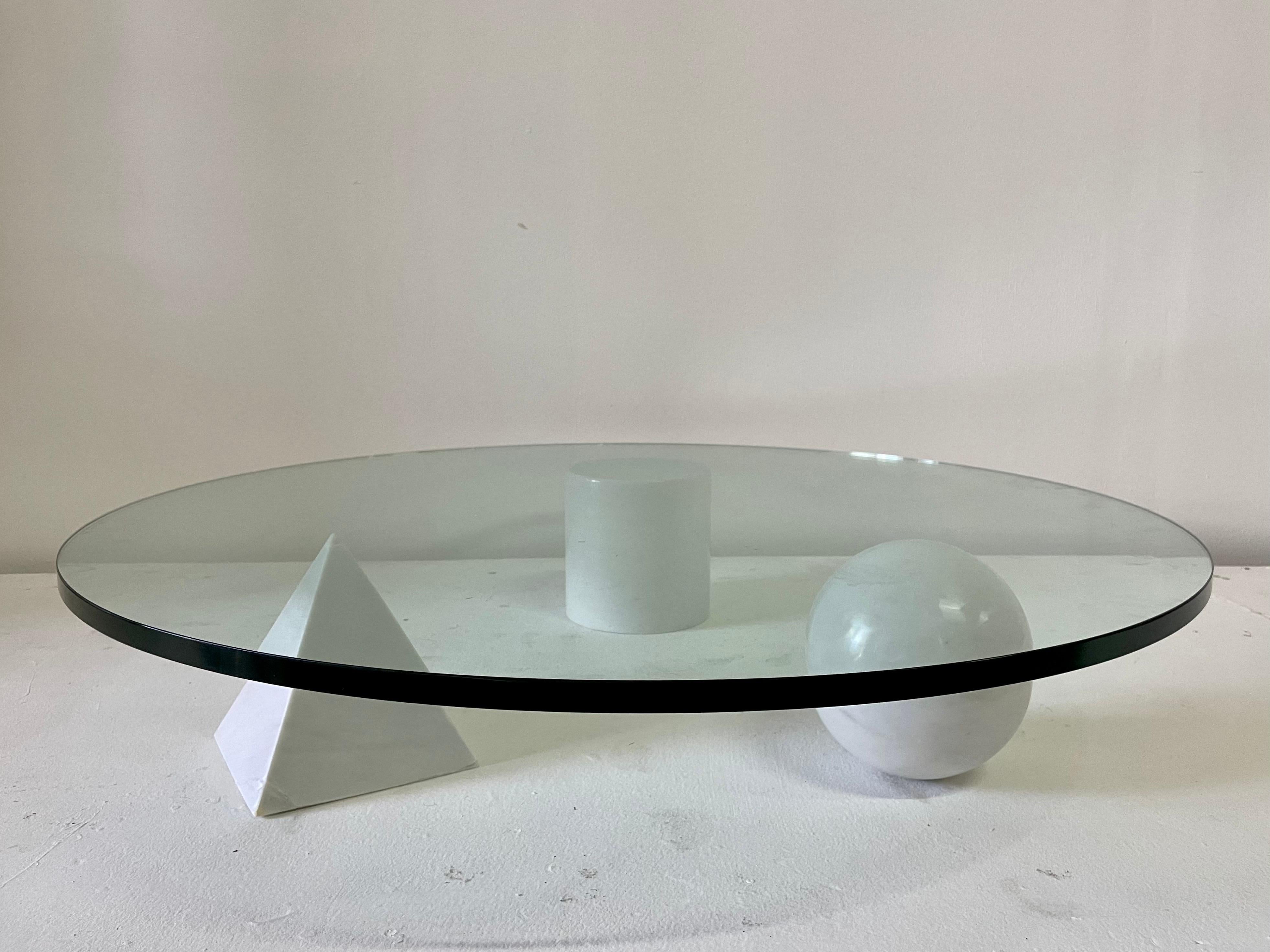 This coffee table was designed by Massimo & Lella Vignelli in 1979. The forms represent the Euclidean geometry of the cylinder, the sphere and the pyramid, all made of solid white marble.

This rare three (3) elements coffee table have independent