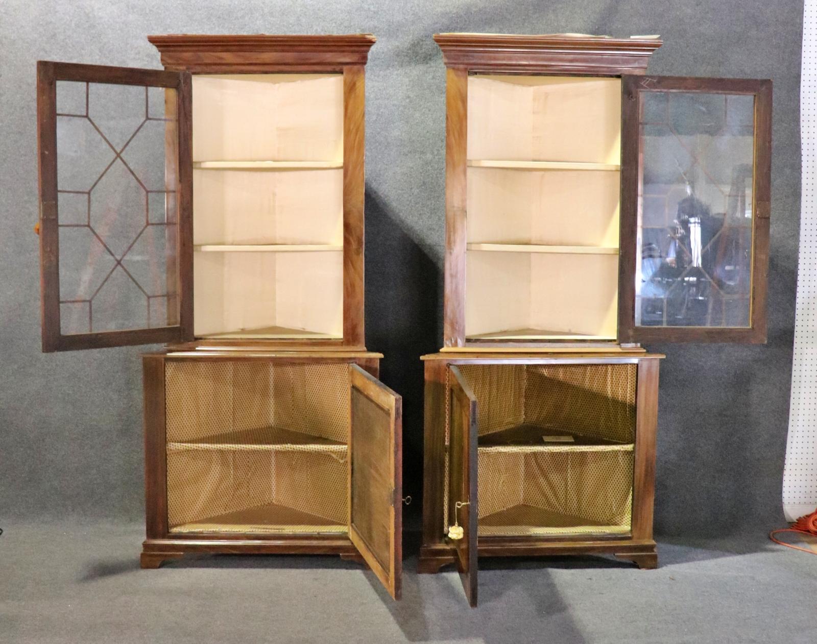 Wood. 2 piece. Top piece has one glass door containing 2 shelves and measures 48 3/8