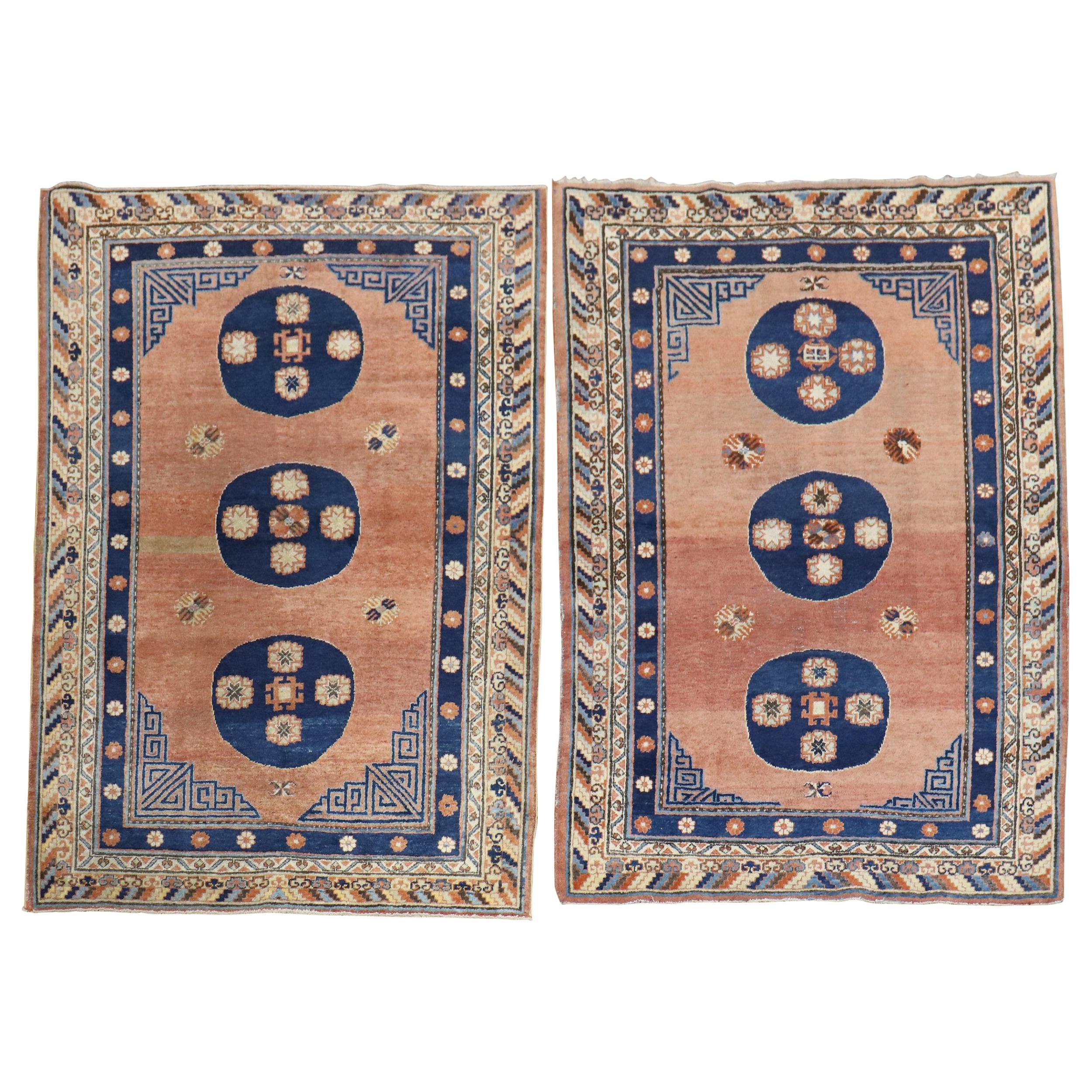 Rare Matching Pair of Antique Khotan Carpets