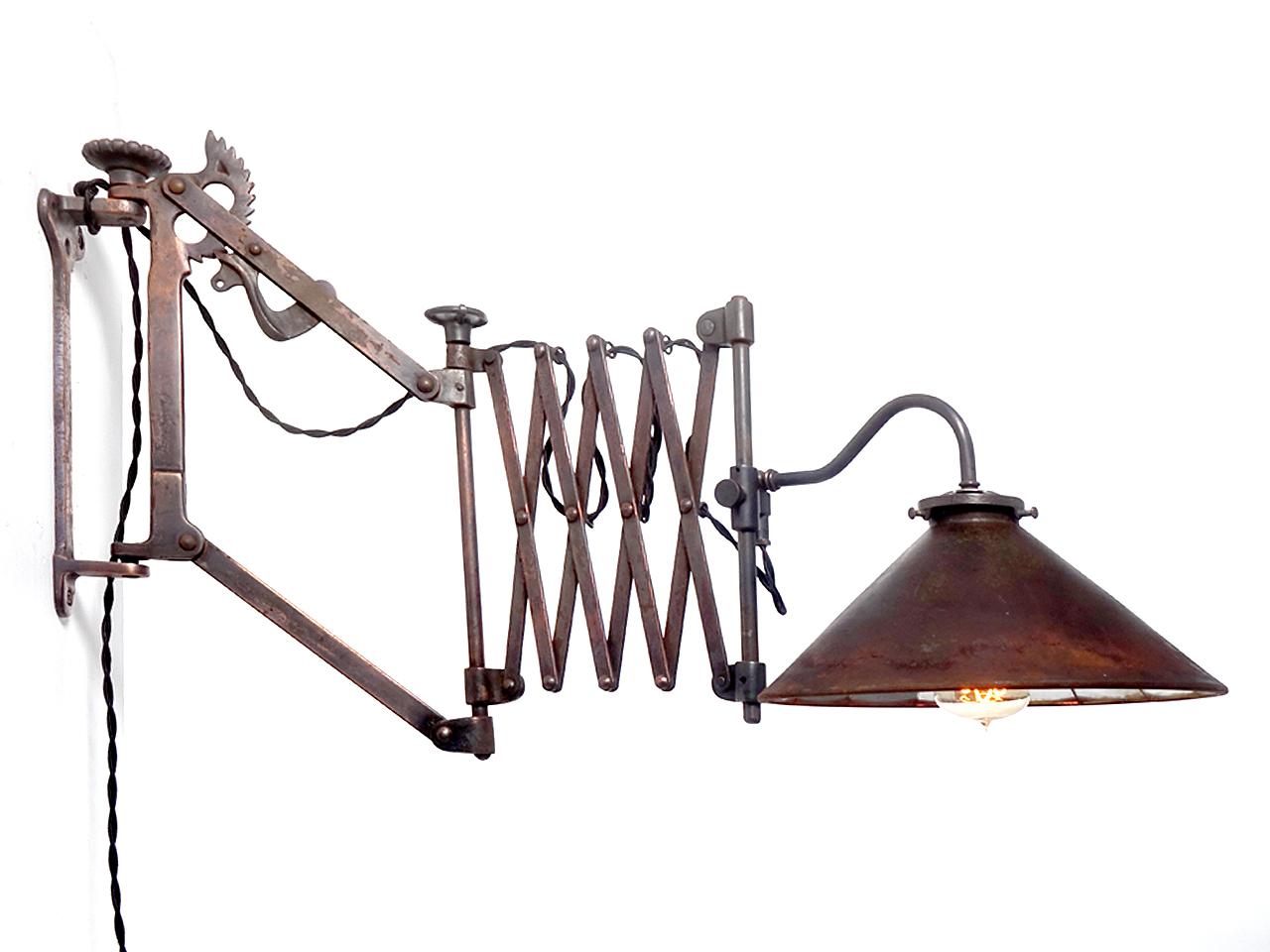 The early W.D. Allison articulated scissor lamp is on the top of every collectors list. This is made even more interesting because there is a perfect matching pair plus they are fitted with beautiful mirrored reflector shades... These date to the