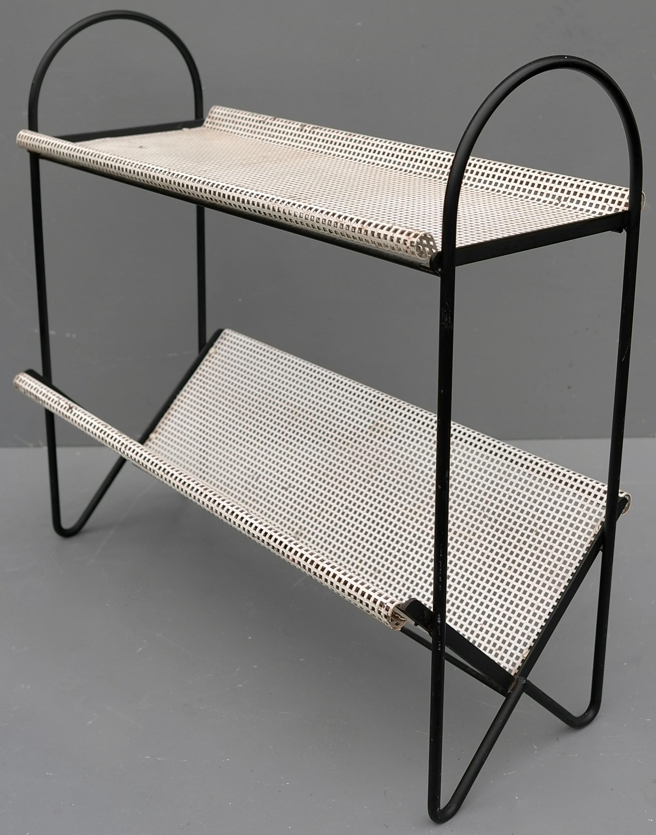 Rare Mathieu Matégot bookstand for Artimeta, 1956. White perforated trays, to use for magazines or books, also useable as a side table. In original vintage condition with the original paint.

This bookstand is shown in the Artimeta catalogue that