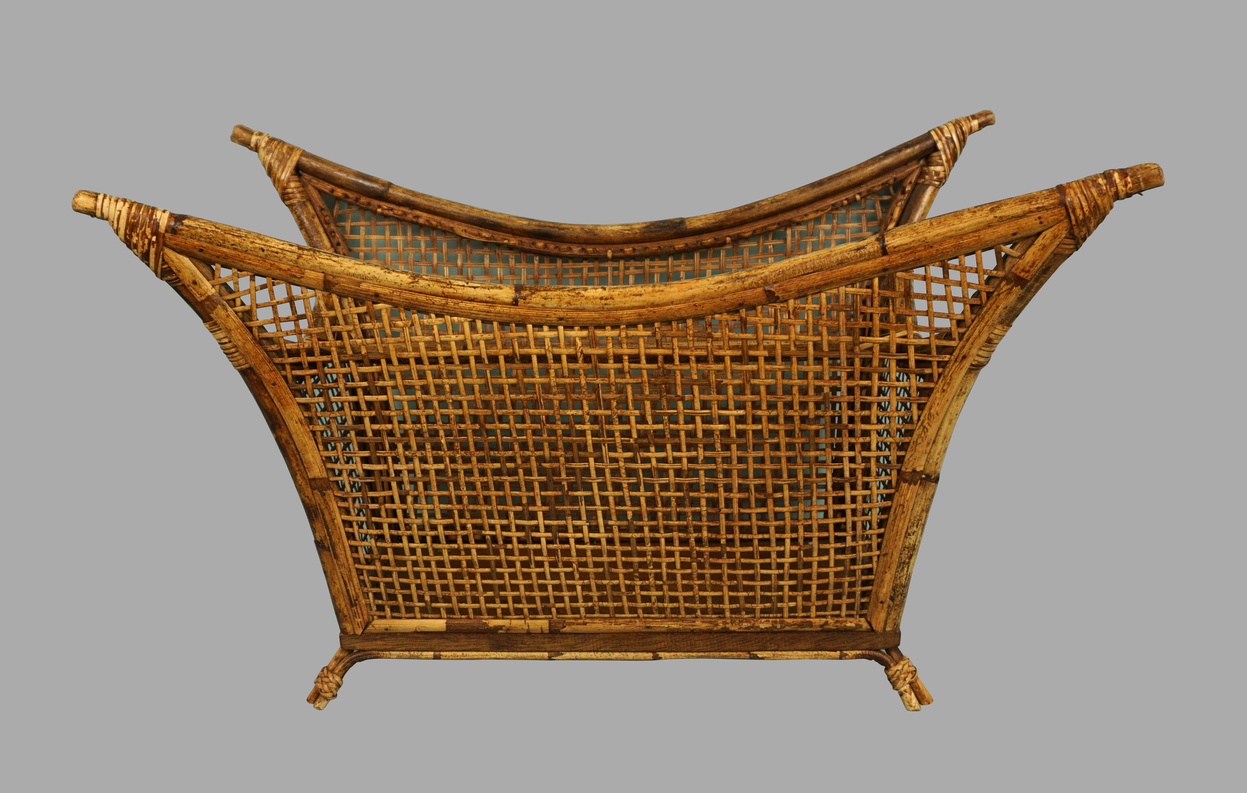 A rare bamboo and cane magazine rack by John and Elinor McGuire of San Francisco purchased from the estate of the original owner, circa 1970. This unusual item is in original condition and shows signs of careful use.