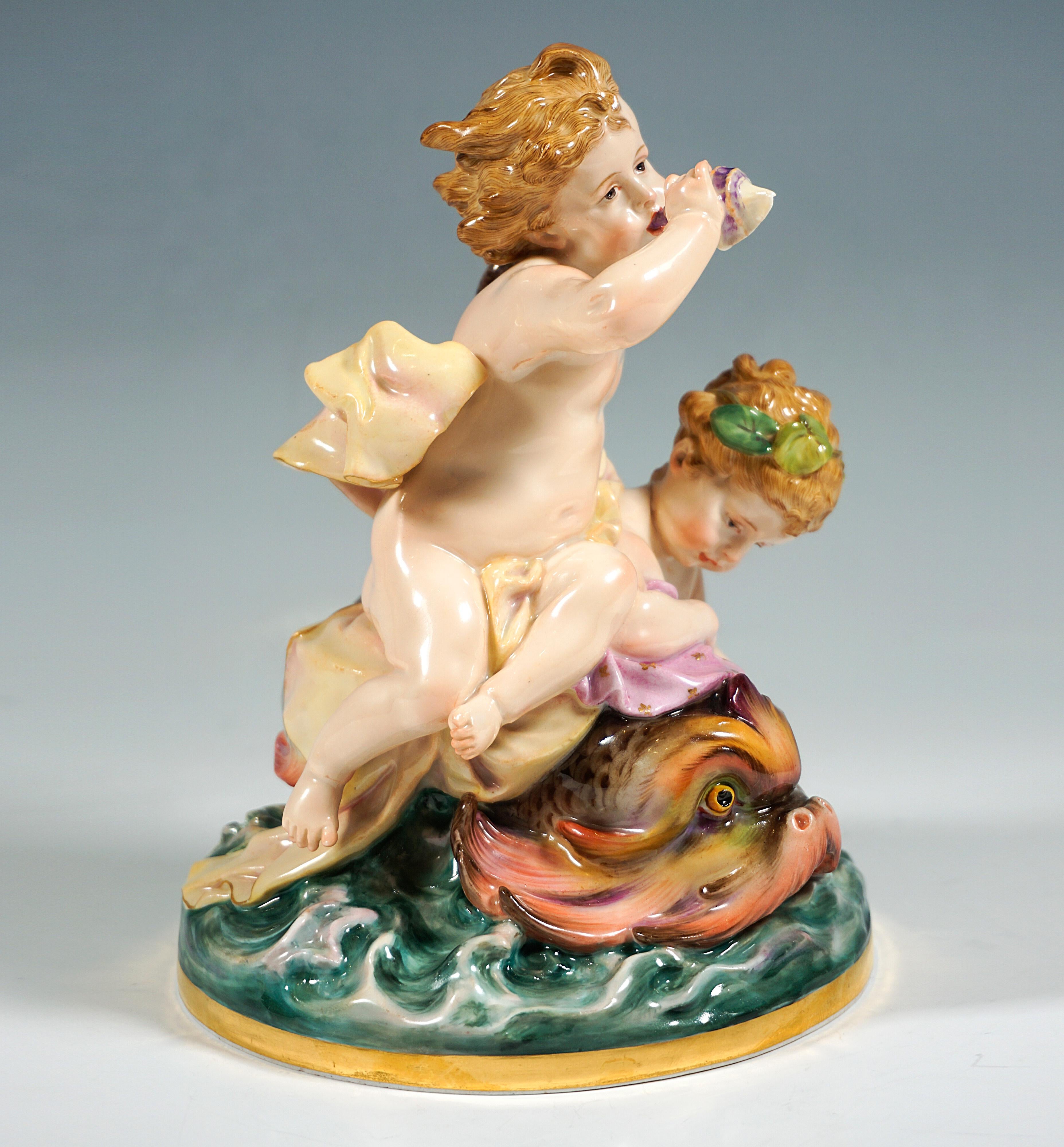 Very rare and loving porcelain figure group of the 19th century:
Two cupids with a dolphin on a restless sea, one of the boys dressed only in cloths sitting on the animal's back and holding on to its raised tail fin, blowing into a snail horn which