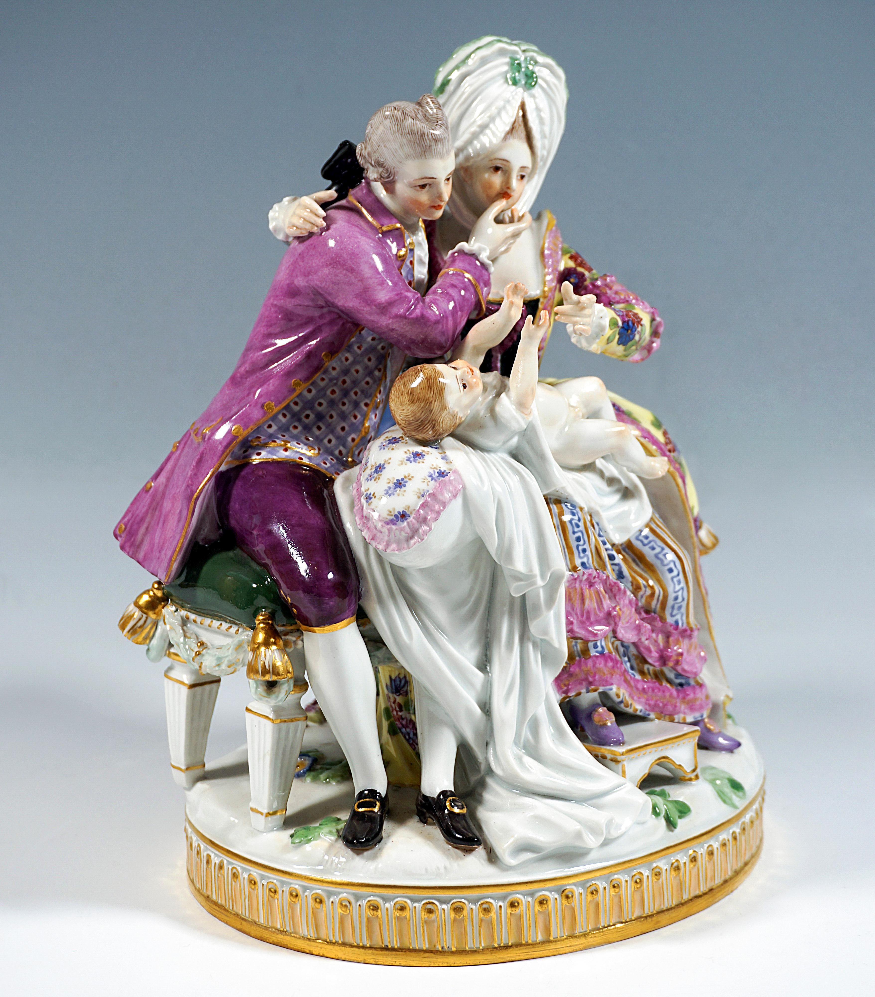 Exceptional Meissen porcelain group of the 19th century:
Young mother in elaborate Rococo house dress: Ruched wide long skirt, bodice, fitted frilled coat with hood, the upswept hair covered by a high voluminous bonnet with ruched hem and bows,