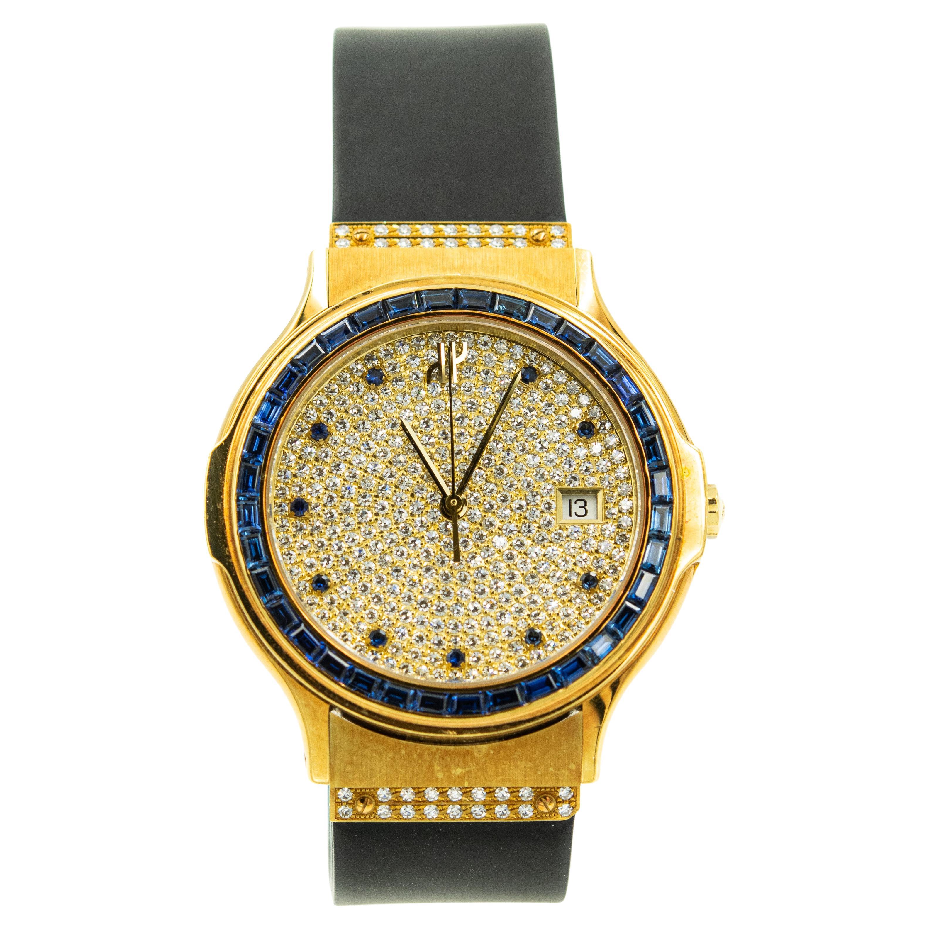 Men's Hublot Wristwatch with Sapphire Bezel and Indexes Ref. 1522.3.081 Serial 282623 features a 37 mm x 44mm 18k yellow gold case, with a pave set diamond dial on a black rubber strap and factory-set diamond buckle. It has a distinctive sapphire