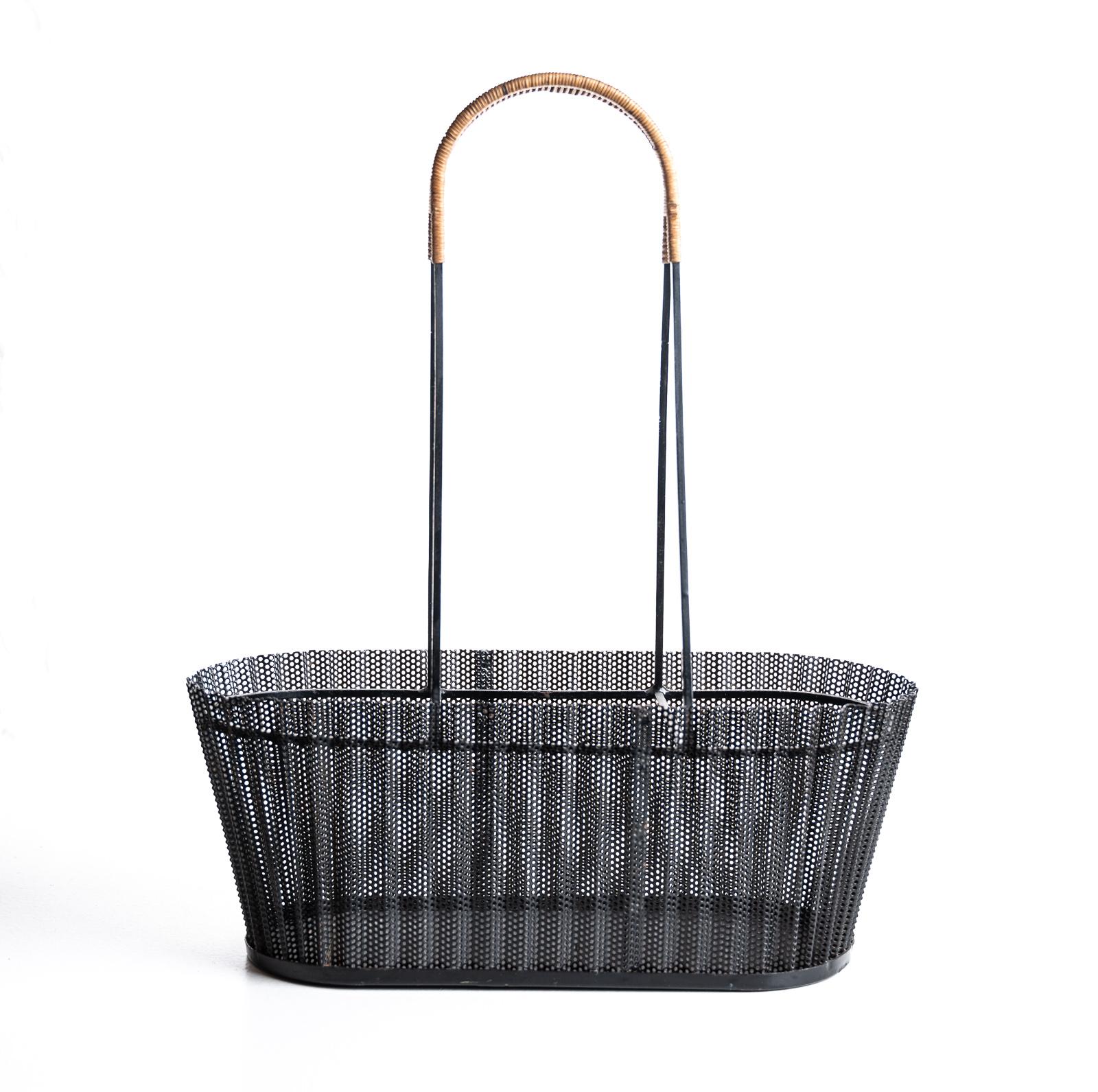 A rare Mathieu Matégot liquor basket with a wicker handle perforated metal, original black paint. In excellent original condition.

documentation: this version on page 12 of the documentation archive pages, Mathieu Matégot by Patrick Favardin,