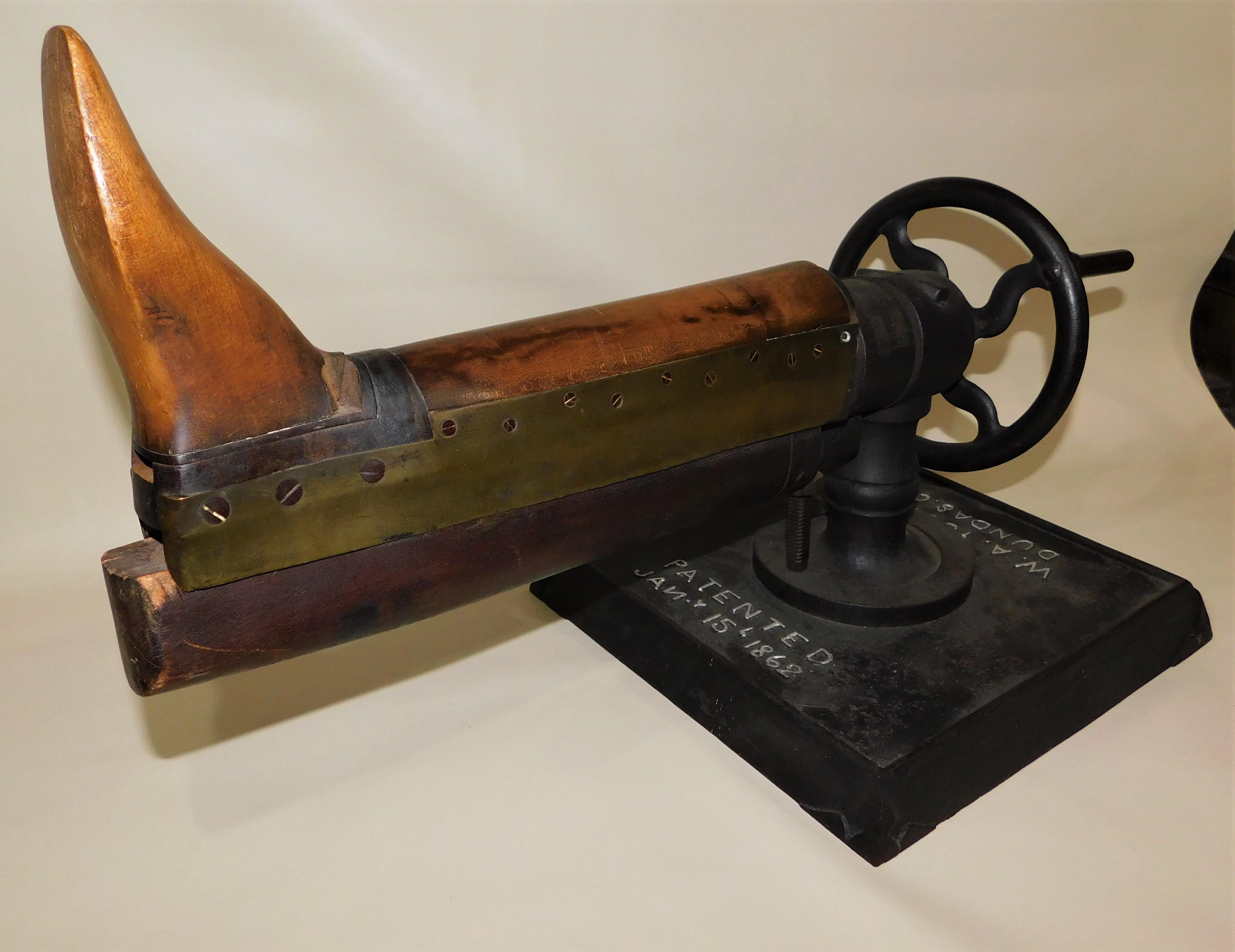 Fabulous unique early Victorian era W.A. Young Dundas (Ontario Canada) C.W. (Canada West) patented Jan. 15 1862 Industrial use leather boot/shoe stretcher. Black painted wrought iron base, wheel and mechanism, brass fittings and wood mold, a