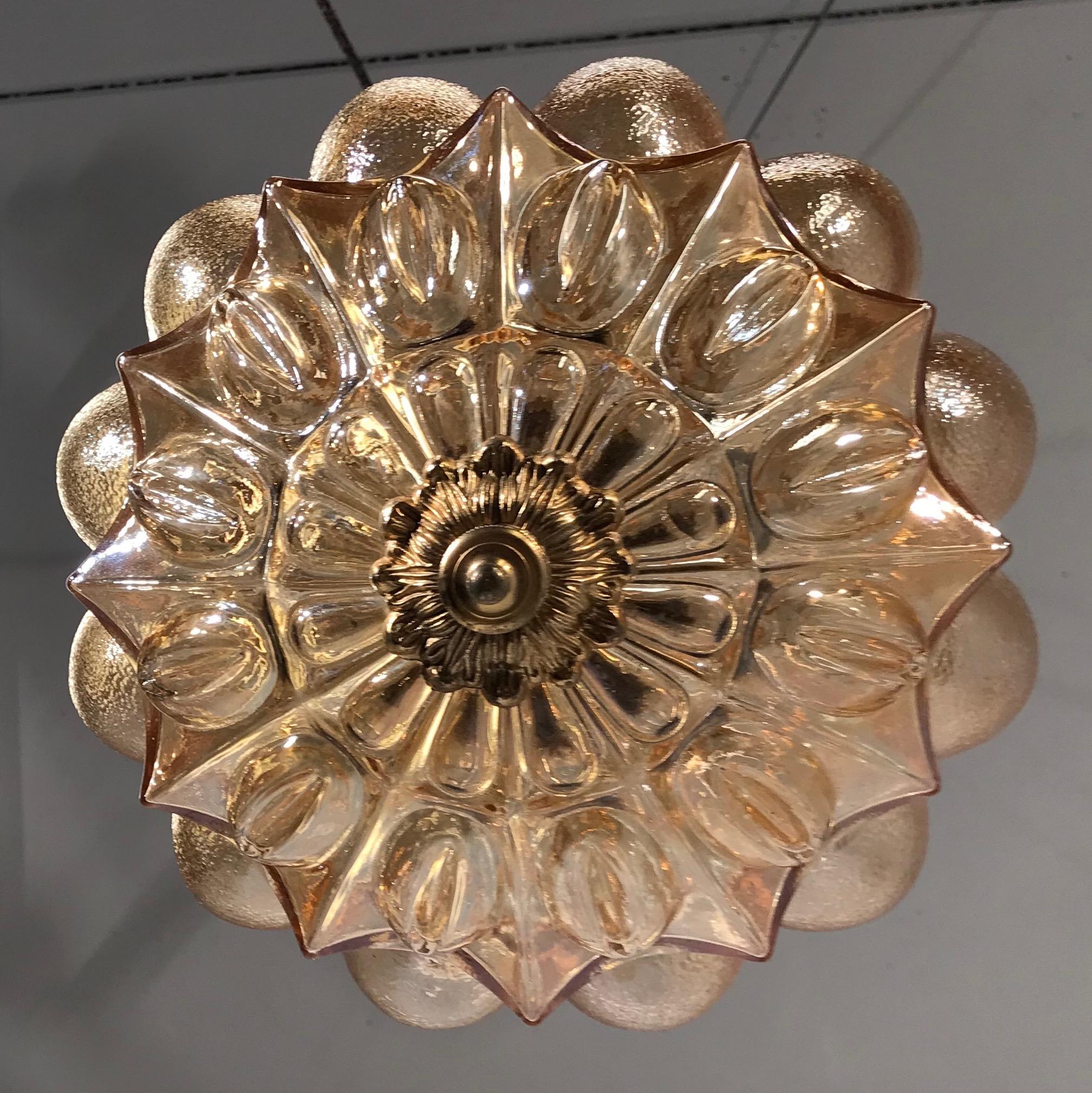 Amber colored and great condition Murano light fixture.

This vintage glass pendant is a rare sight to see and the light it radiates creates a beautiful and warm atmosphere, no matter where you decide to hang her. This rare design and handcrafted