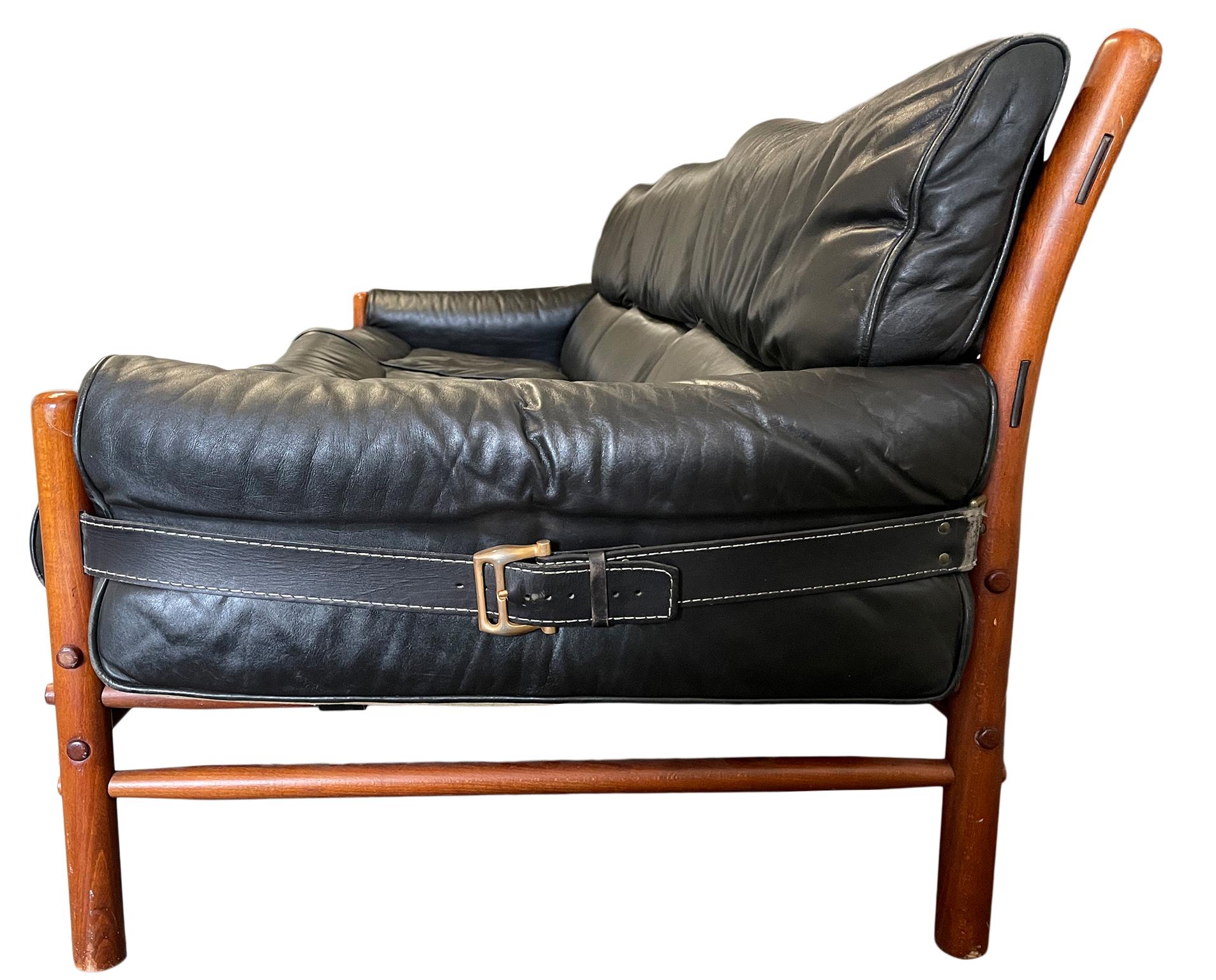 black leather mid century sofa