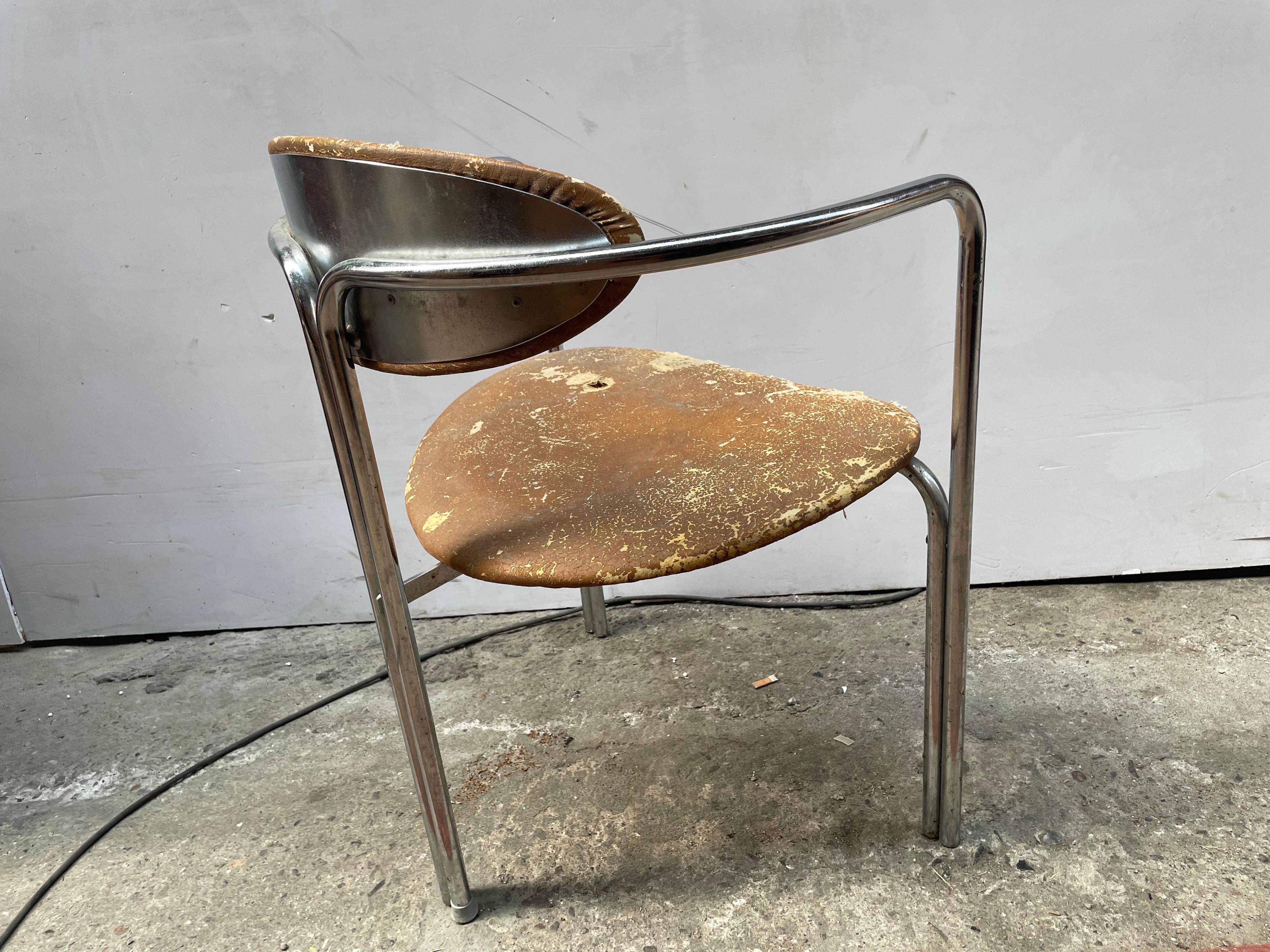 Mid-century modern chair, preserved in its original condition. This rare piece, probably designed by a Danish designer and inspired by Bauhaus minimalism, features a distinctive metal backrest that is rarely seen, adding to its exclusivity.

The